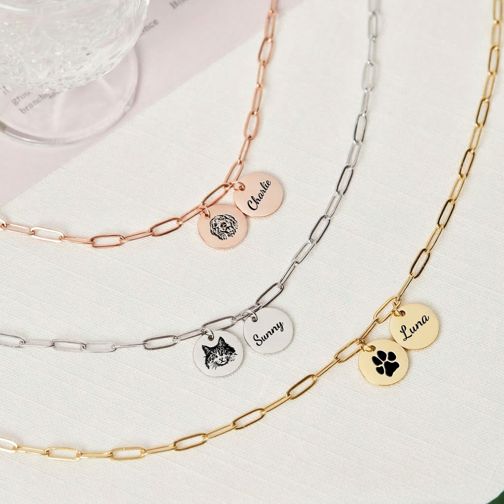 Three paperclip chain pet portrait necklaces in rose gold, silver, and gold with custom name pendants