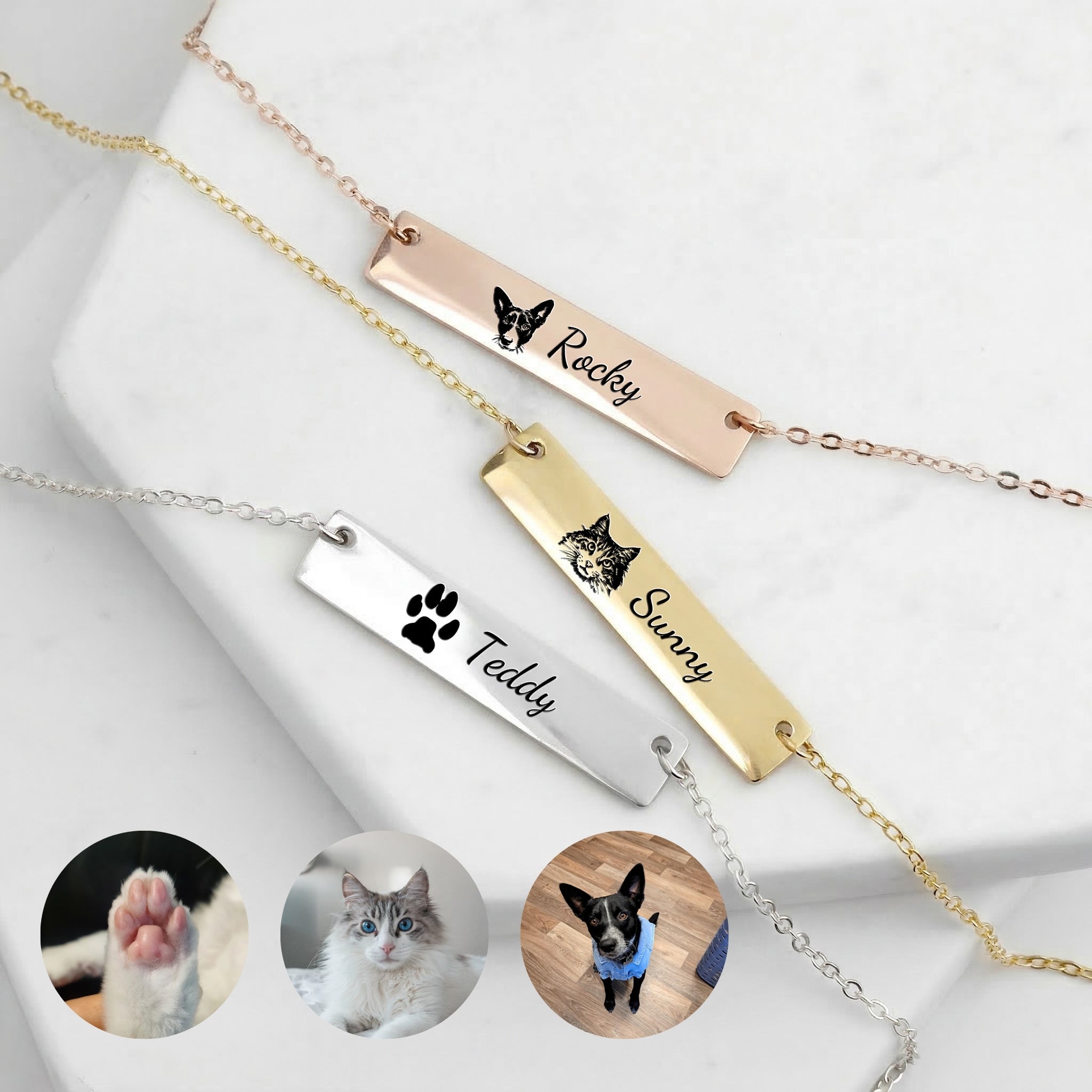 Three pet portrait bar necklaces in silver, gold, and rose gold with different pet engravings on marble