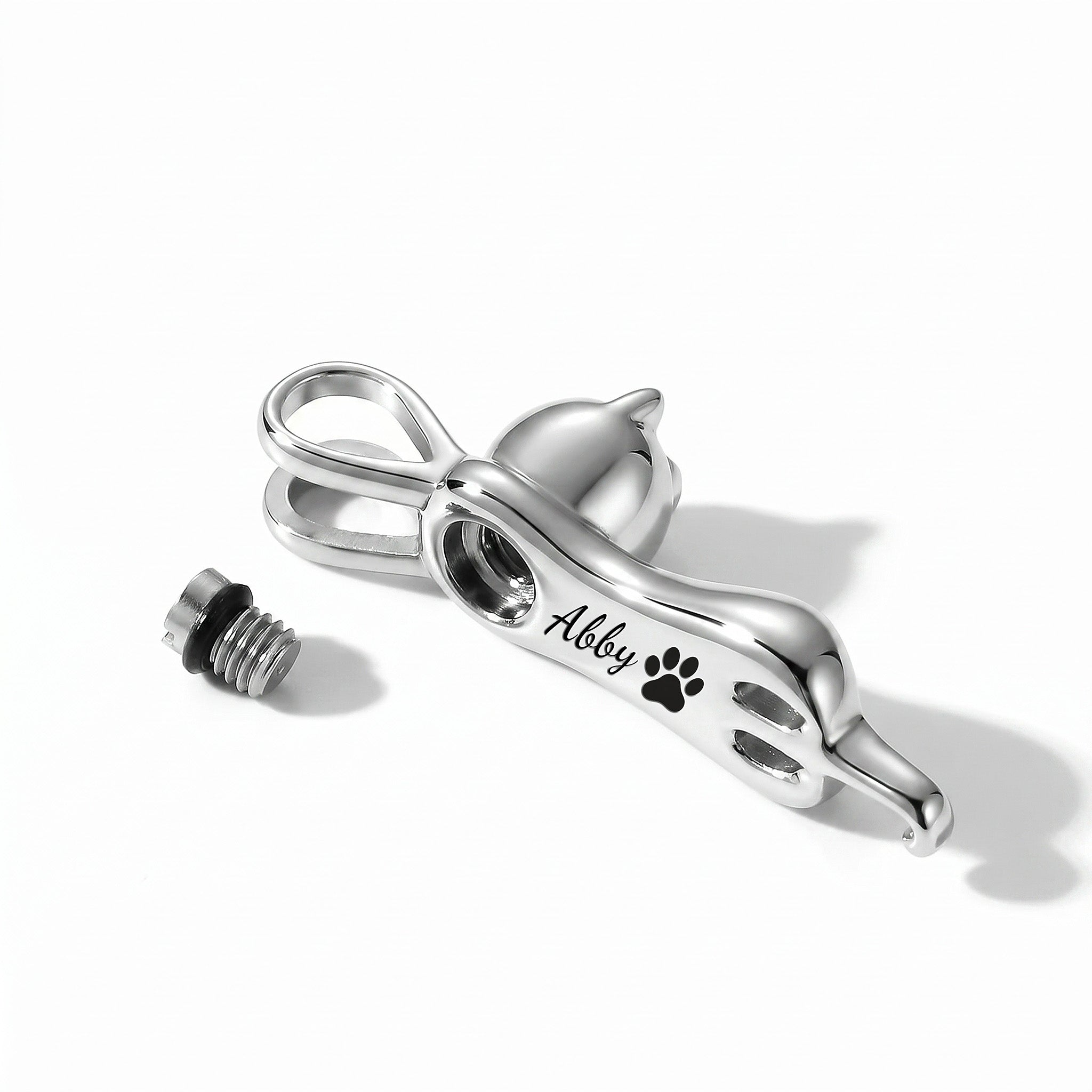 Cat urn necklace shown with screw cap removed revealing internal urn cavity opening for cat ashes