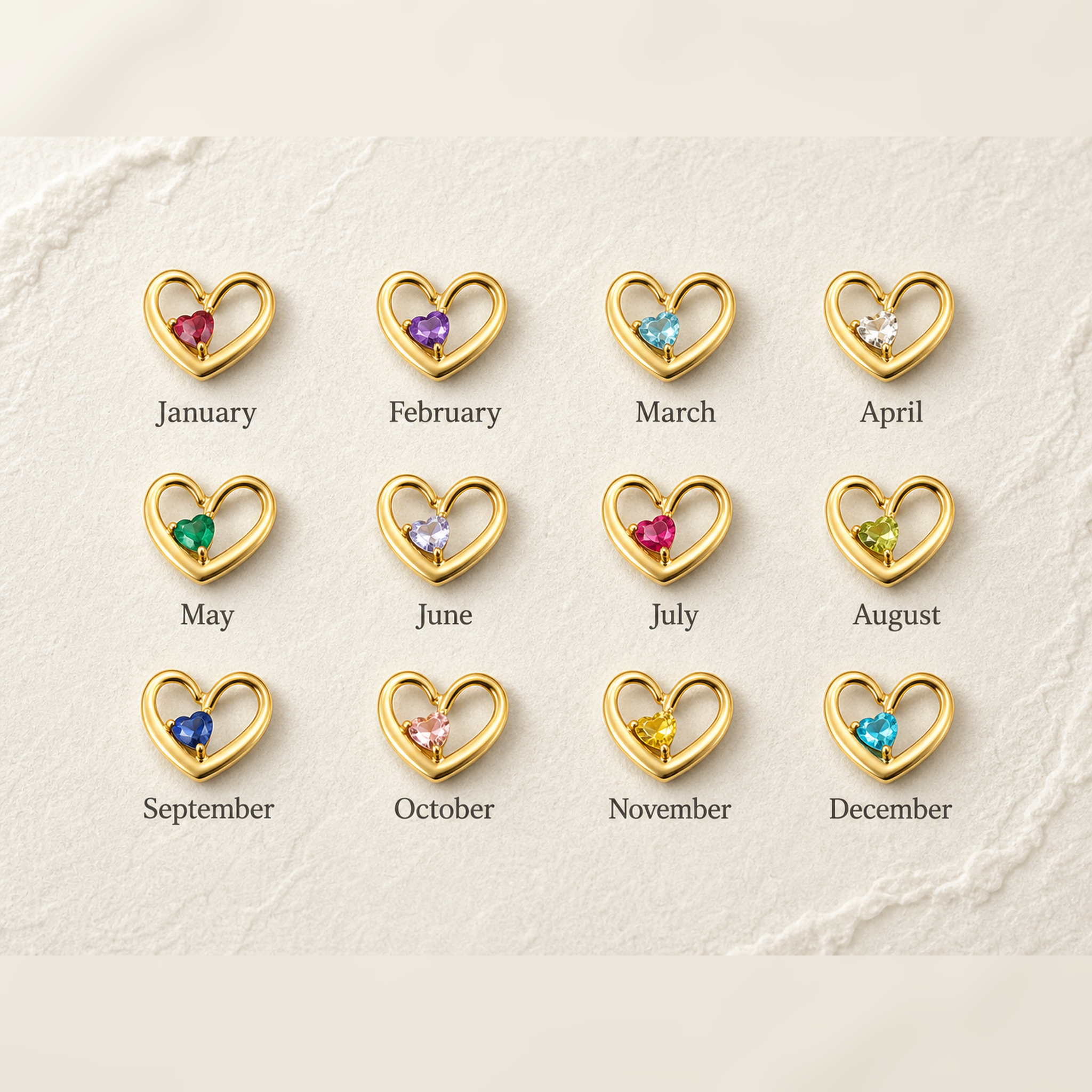 Birthstone color chart showing 12 heart pendants in 18K gold, one for each month from January to December