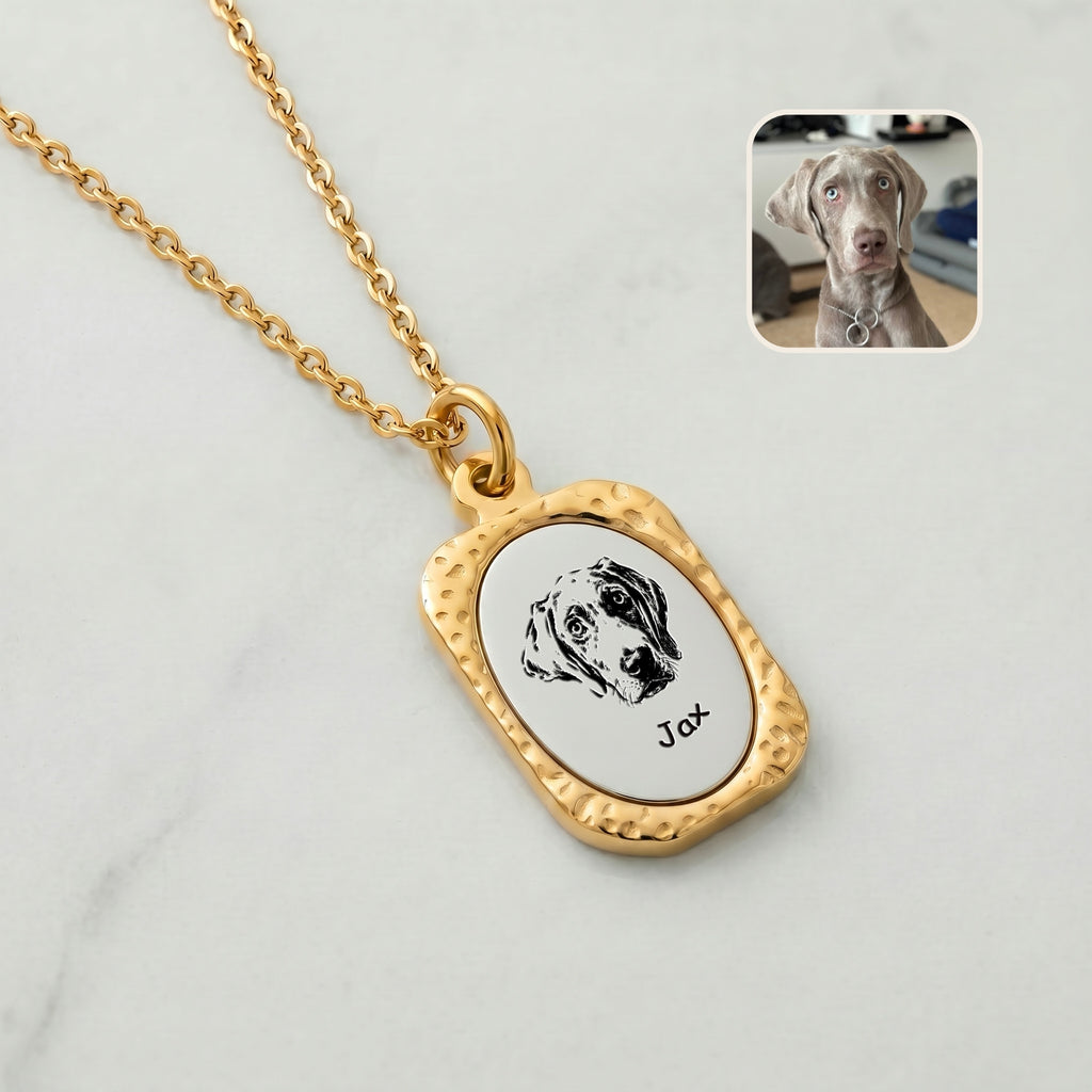 Close-up of 18K gold custom pet portrait pendant with hand-drawn Weimaraner engraving on brushed silver face