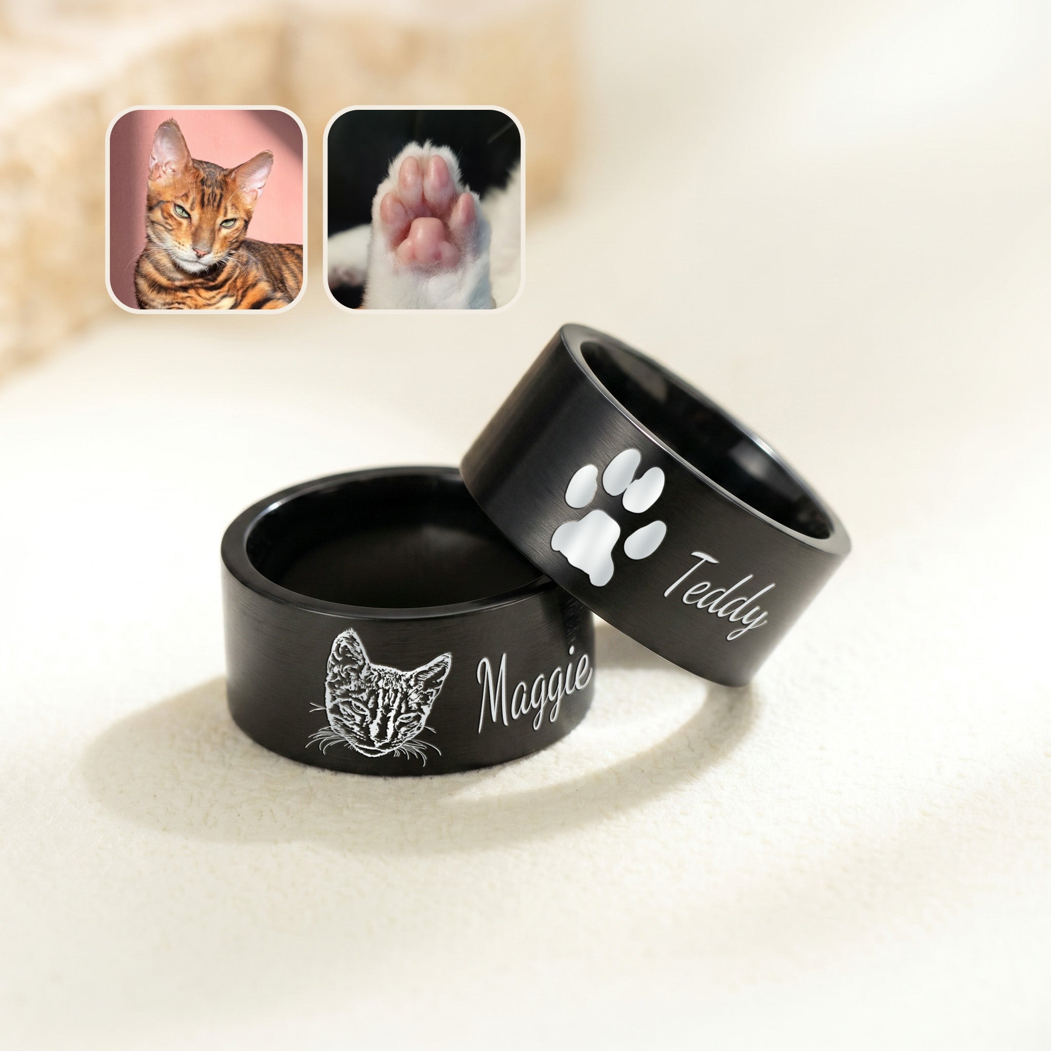 Two matte black wide band pet rings on cream fabric, engraved with a hand-drawn portrait and a script name, beside pet photos