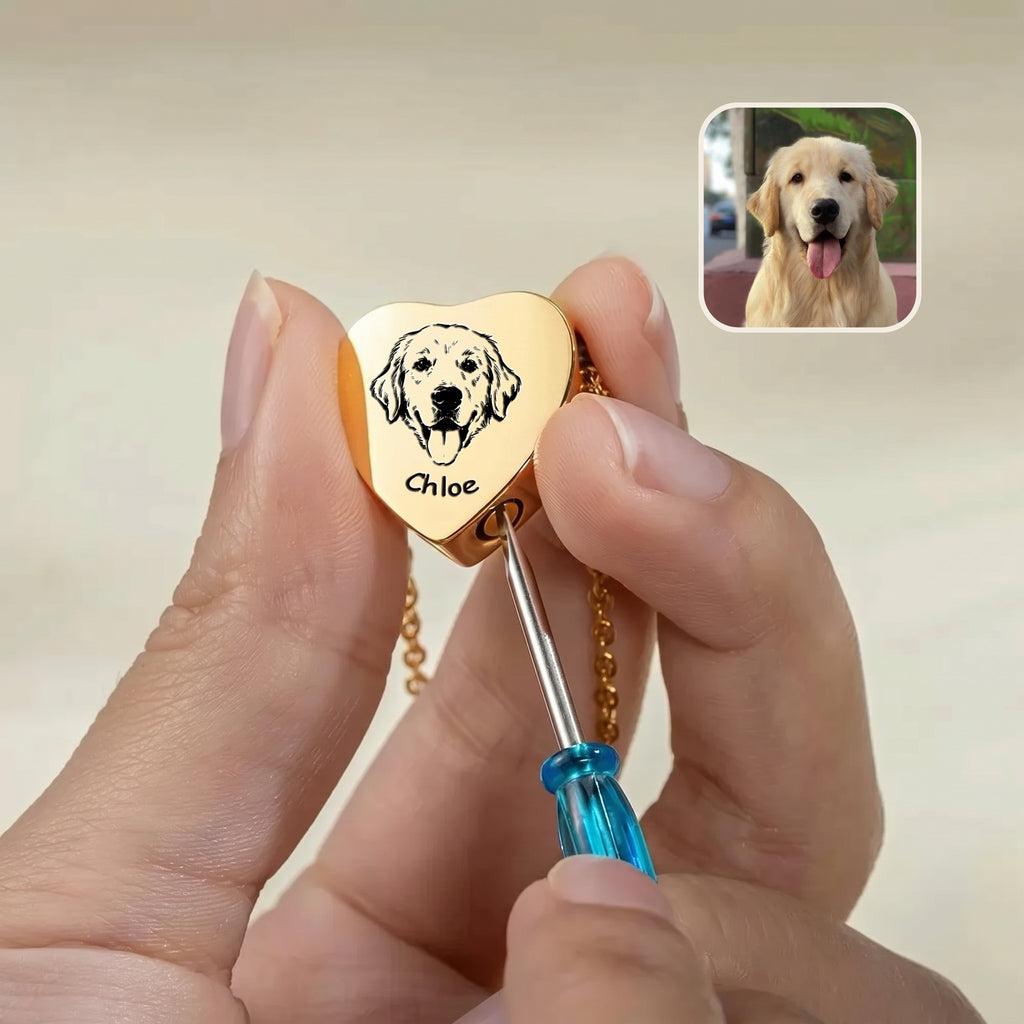 18k gold heart urn pendant held in hand with screwdriver showing screw cap opening for ashes