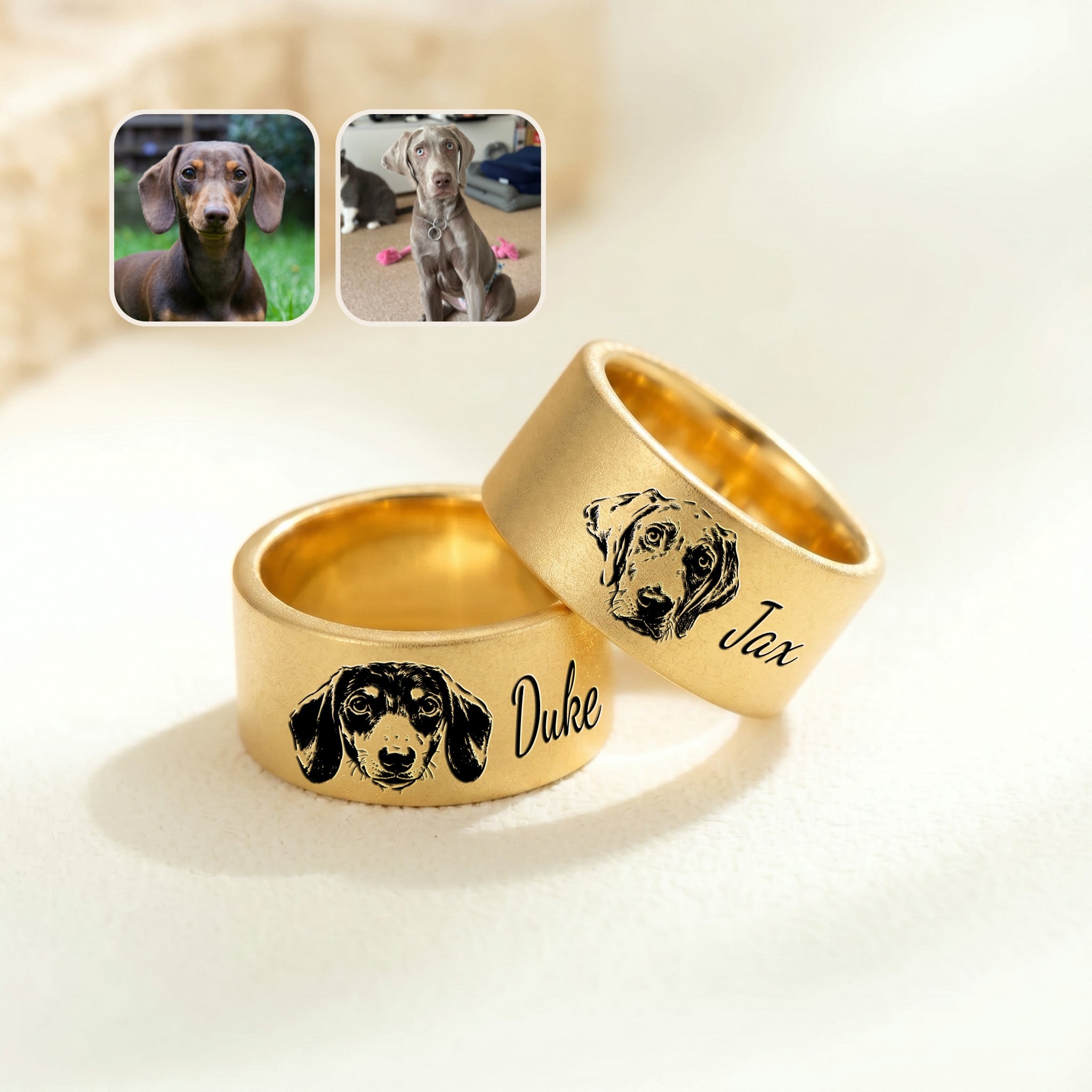 Two gold wide band pet rings on cream fabric, each engraved with a hand-drawn dog portrait and a script name, beside reference photos