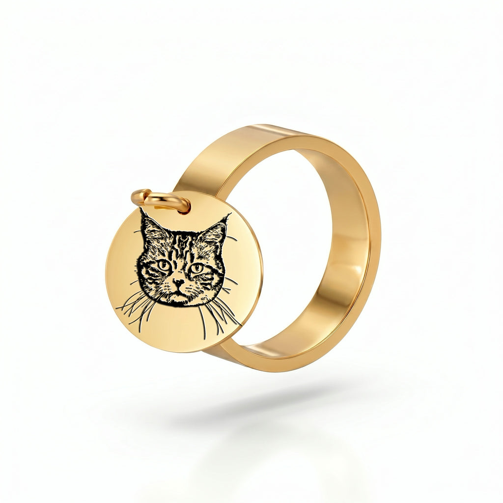 Yellow-gold disc ring with an engraved pet portrait, shown alone on a white studio background