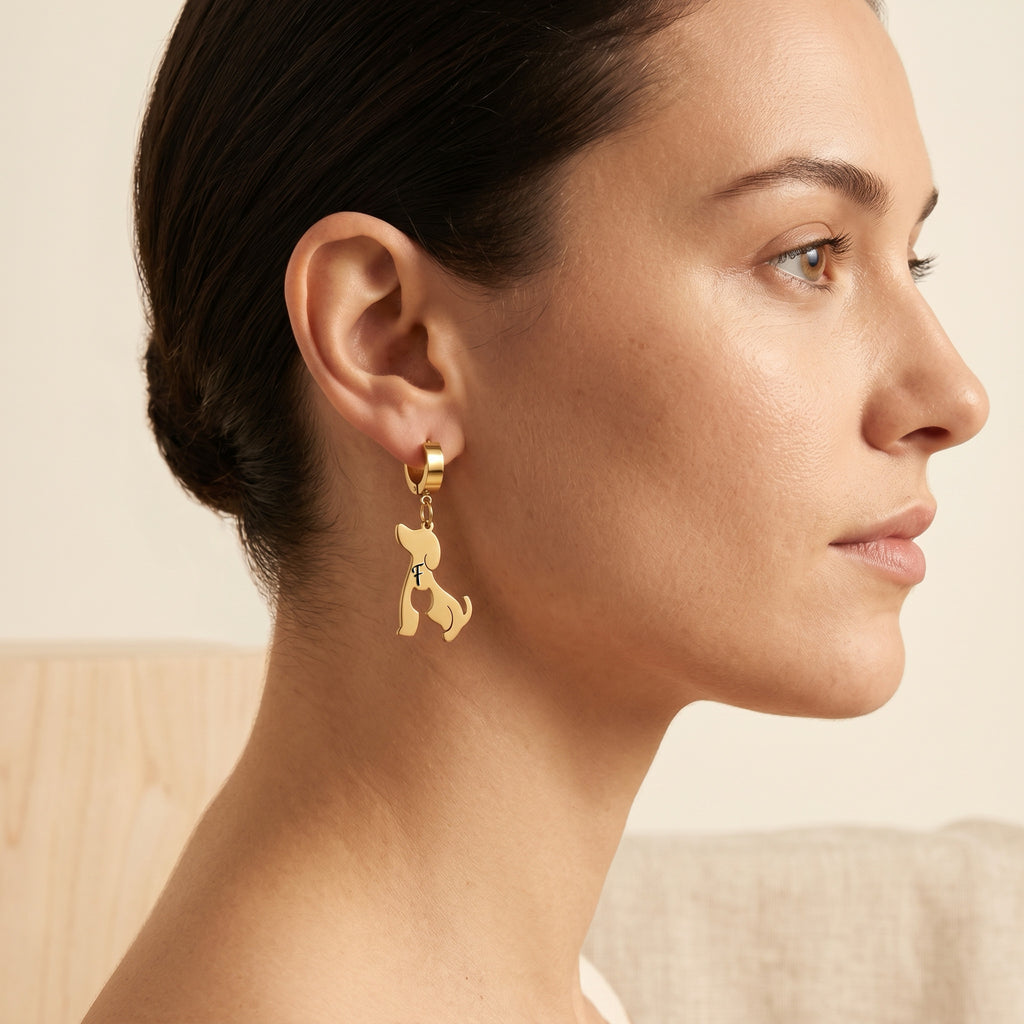 Side profile of a model wearing a gold dog-silhouette earring