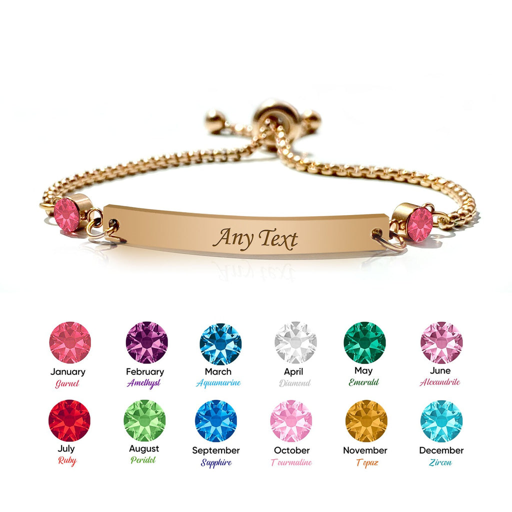 18K gold name bar bracelet on white beside a chart of 12 monthly birthstone colors from January to December