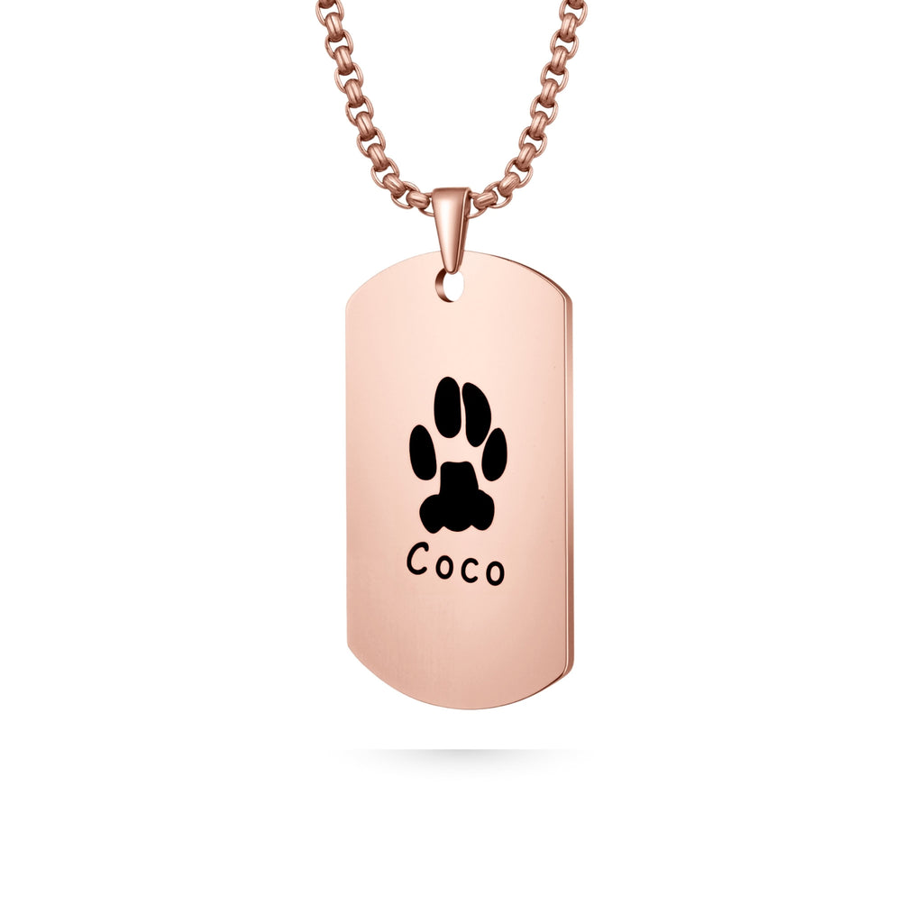 Rose gold dog tag shaped pendant necklace with laser-engraved paw print on white background