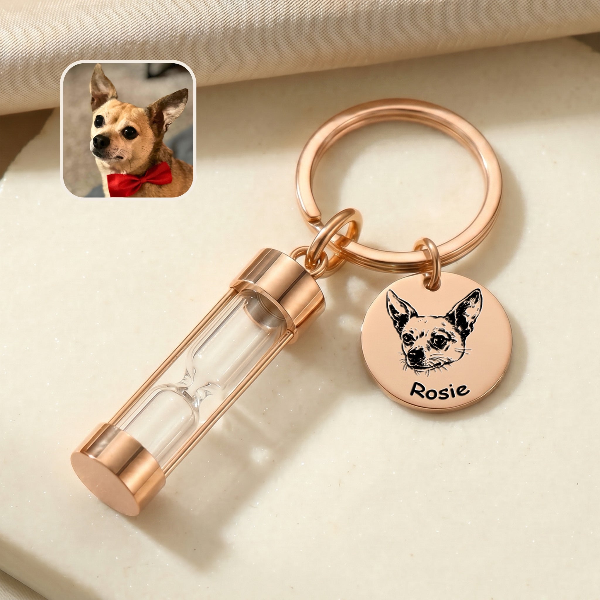 18k rose gold-plated pet portrait hourglass keychain on marble surface with engraved chihuahua portrait disc and glass hourglass urn, with reference photo inset
