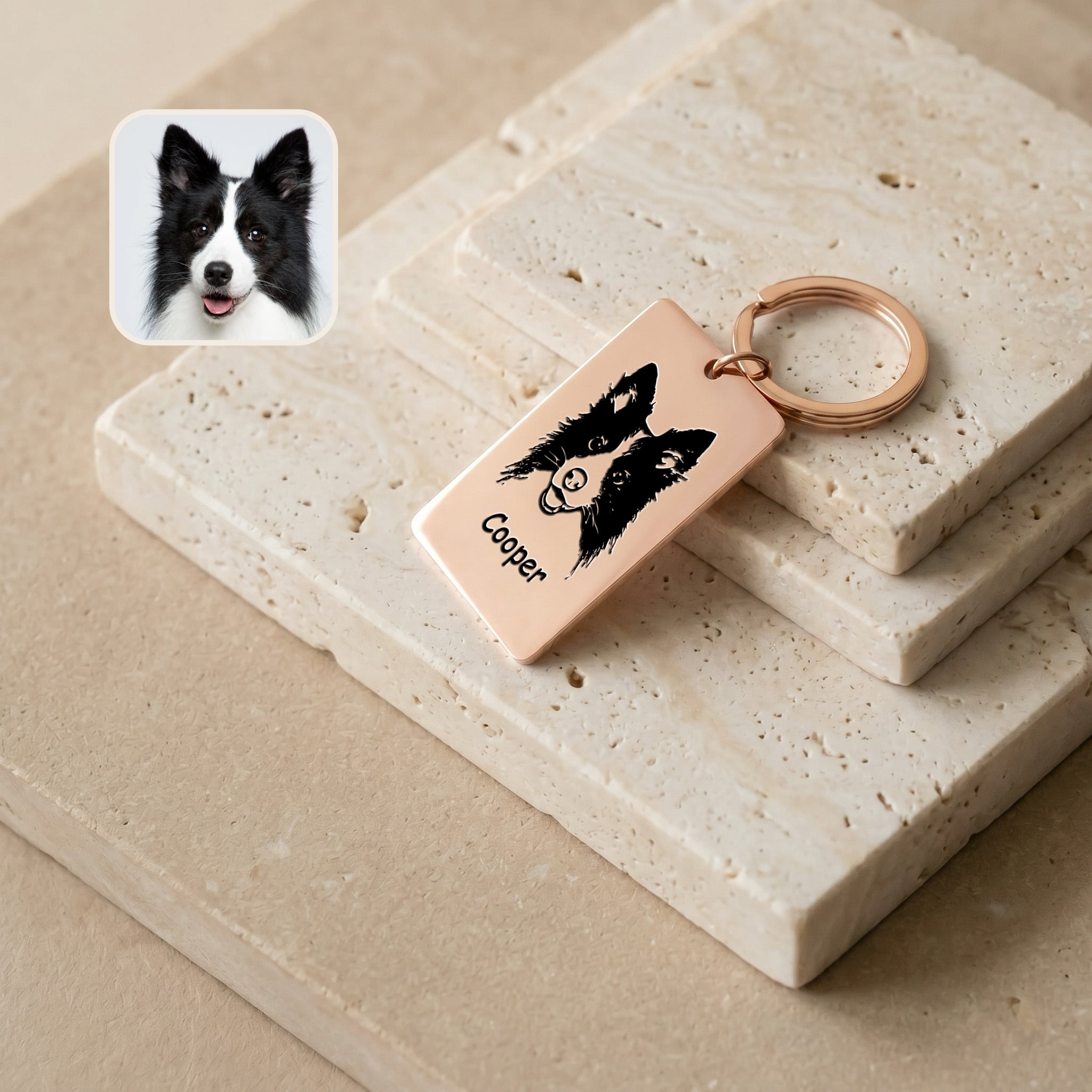 18k rose gold pet portrait plate keychain on stacked travertine with a Border Collie reference photo inset, hand-drawn portrait and name 'Cooper' engraved
