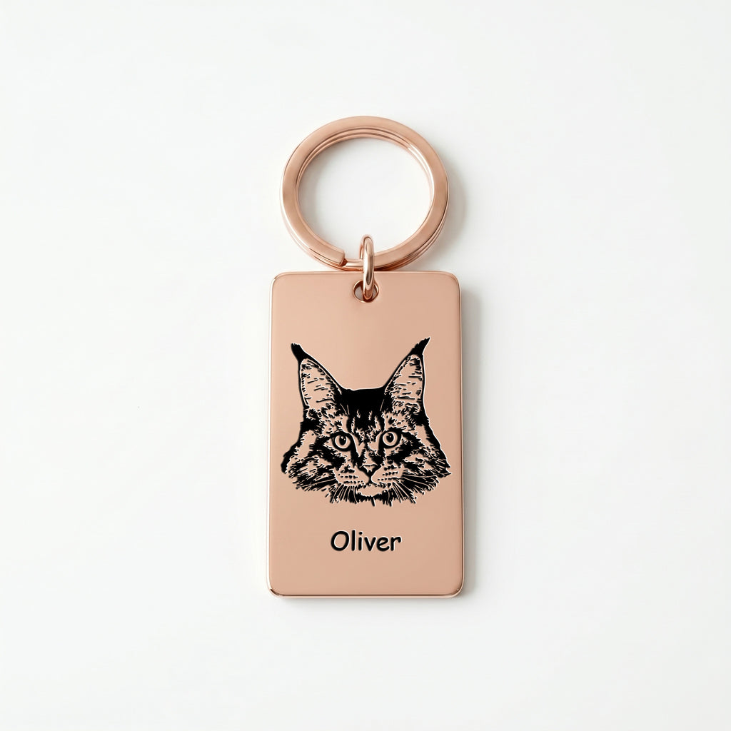 18k rose gold pet portrait plate keychain on white background, cat portrait and name engraved on the rectangular steel plate