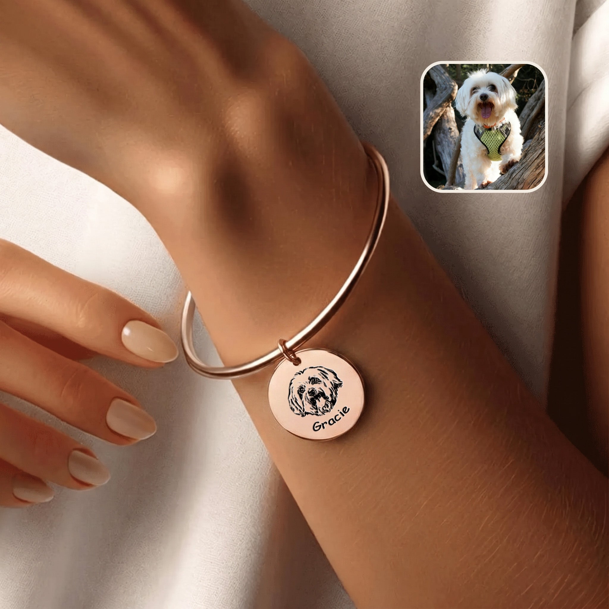 18K rose gold pet photo cuff bracelet with hand-drawn portrait disc charm, worn on a wrist beside an inset dog photo
