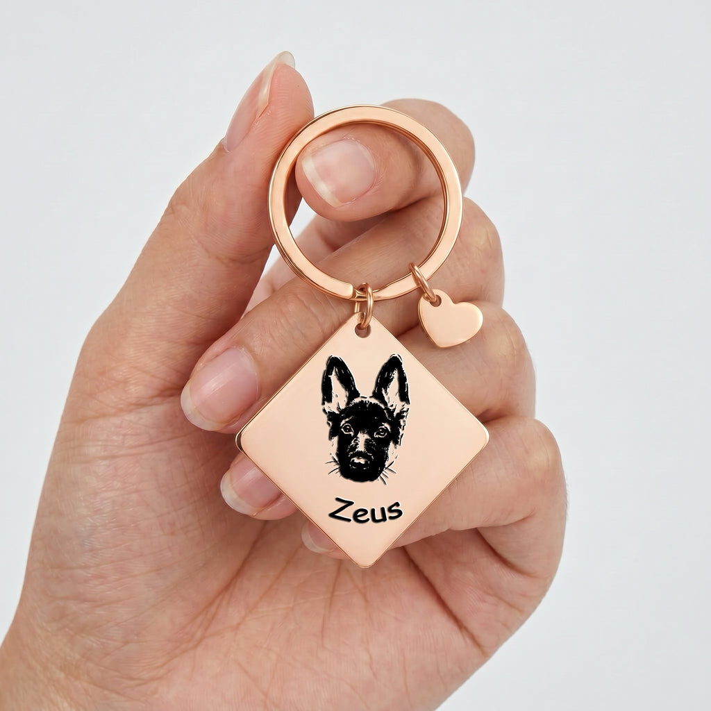 18k rose gold pet portrait square keychain held in hand showing the square plate and heart charm at scale