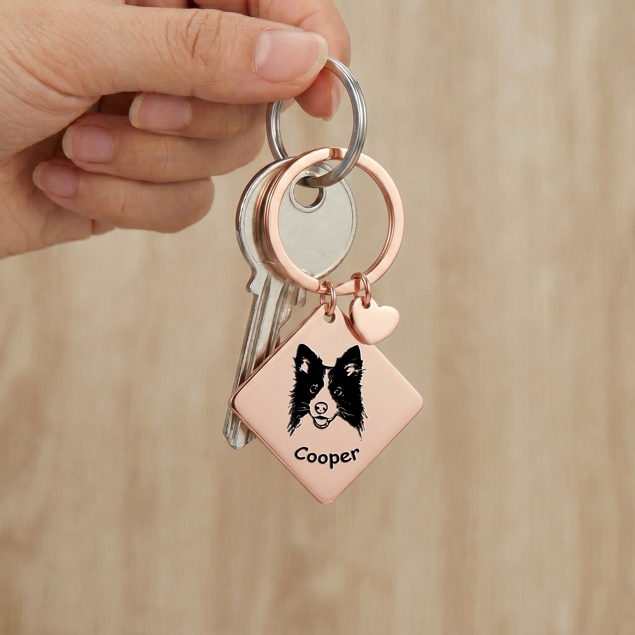 18k rose gold pet portrait square keychain clipped to keys with hand-drawn portrait visible