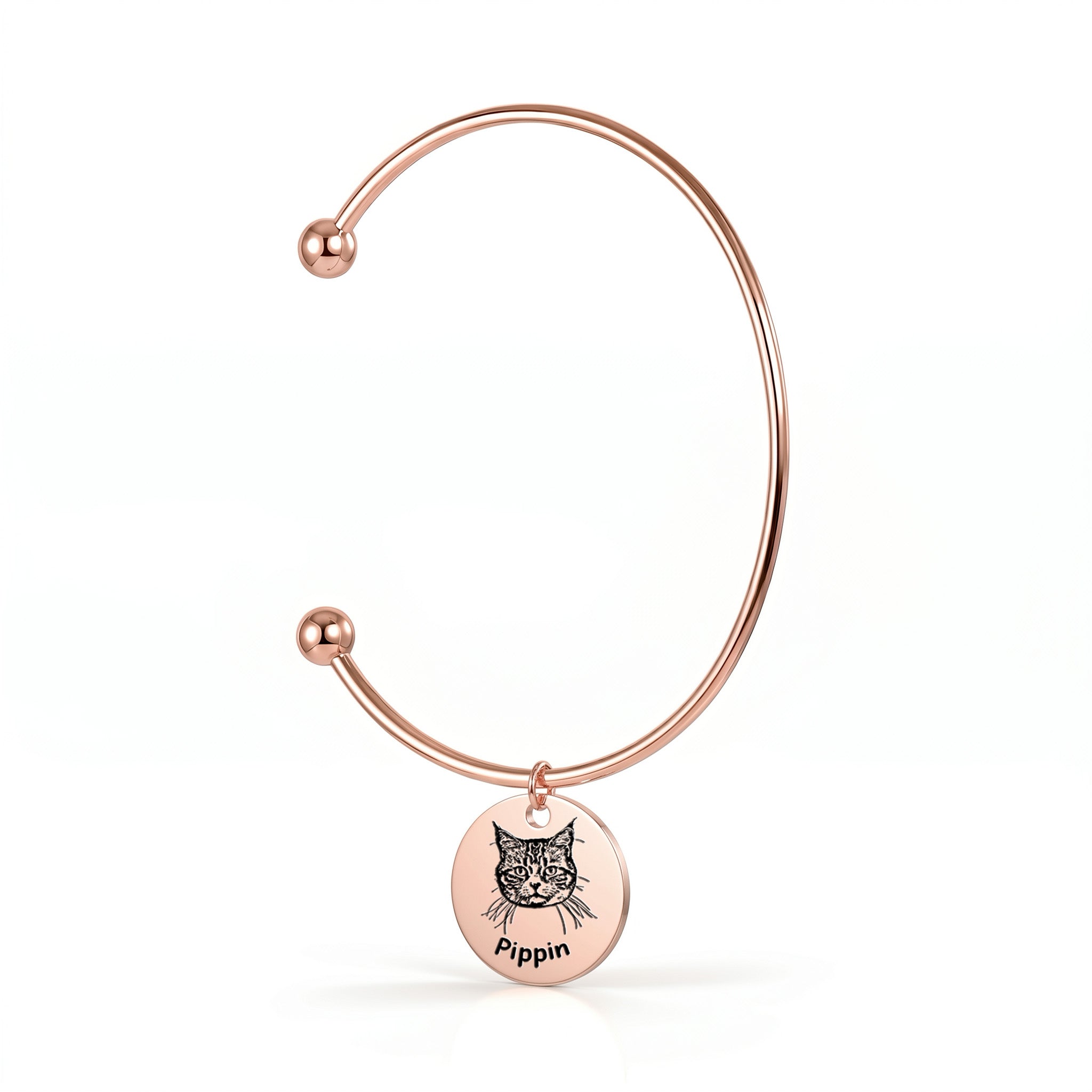 18K rose gold open cuff bracelet with engraved pet portrait disc charm on a white background