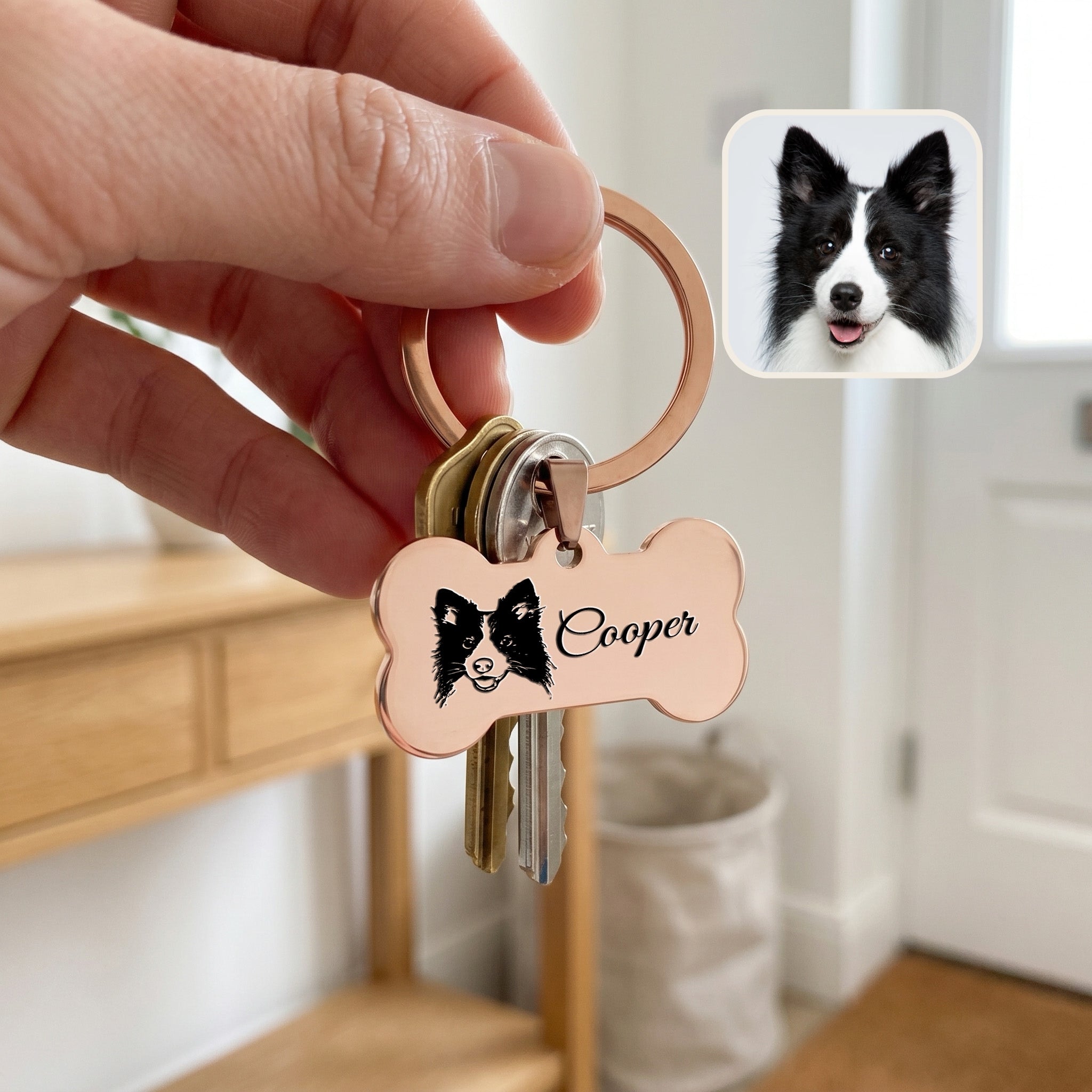 18k rose gold pet bone keychain held in hand with keys — showing scale of the bone pendant for daily carry