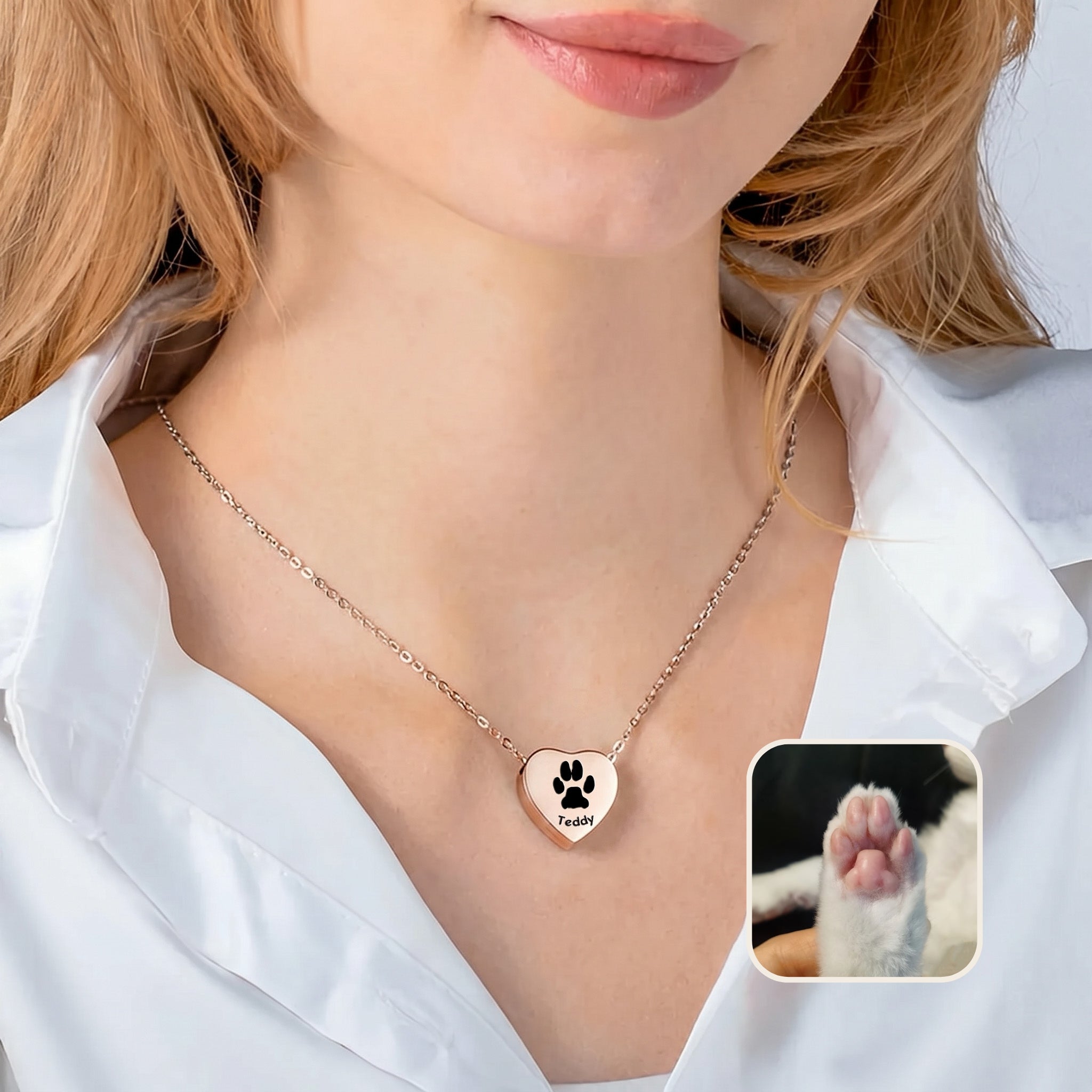 Woman wearing 18k rose gold heart urn necklace with paw print engraving and pet photo reference inset