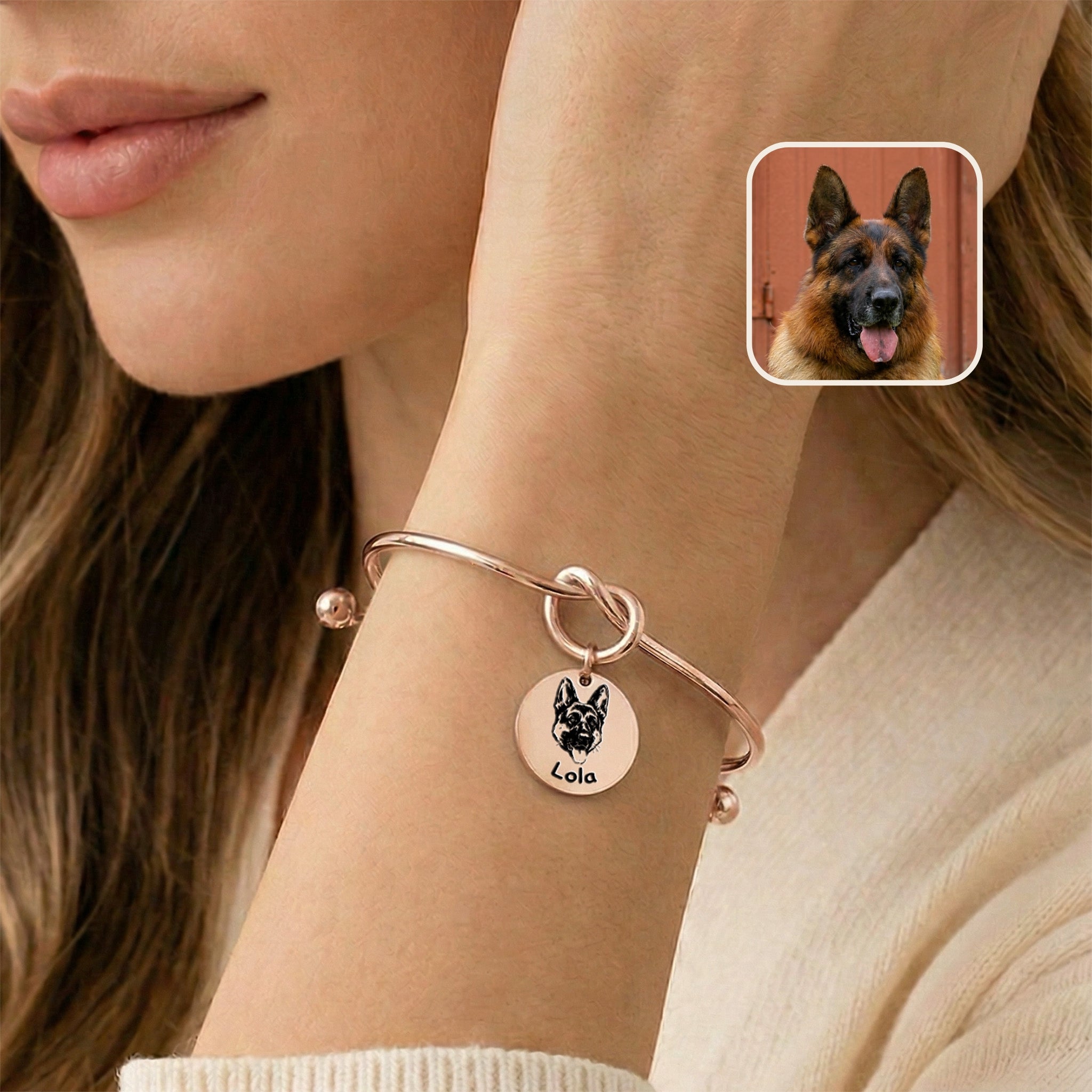 Rose gold knot cuff bracelet with engraved German shepherd portrait charm worn on a wrist near the face, photo inset