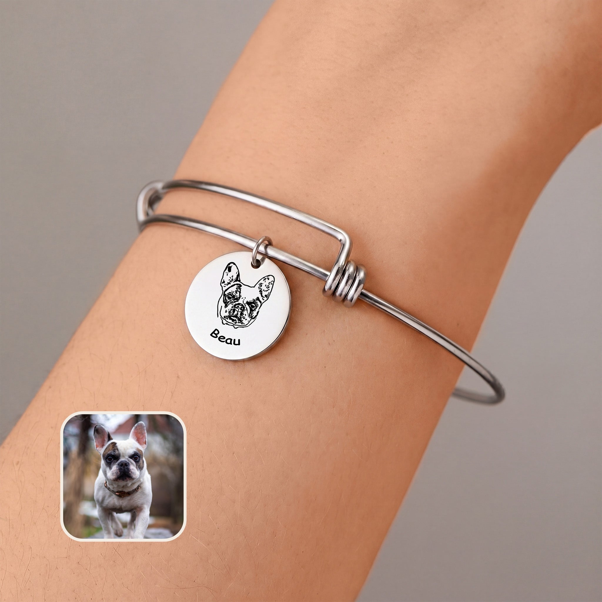 Rhodium silver pet photo disc wire bracelet with one hand-drawn portrait charm, worn on the wrist