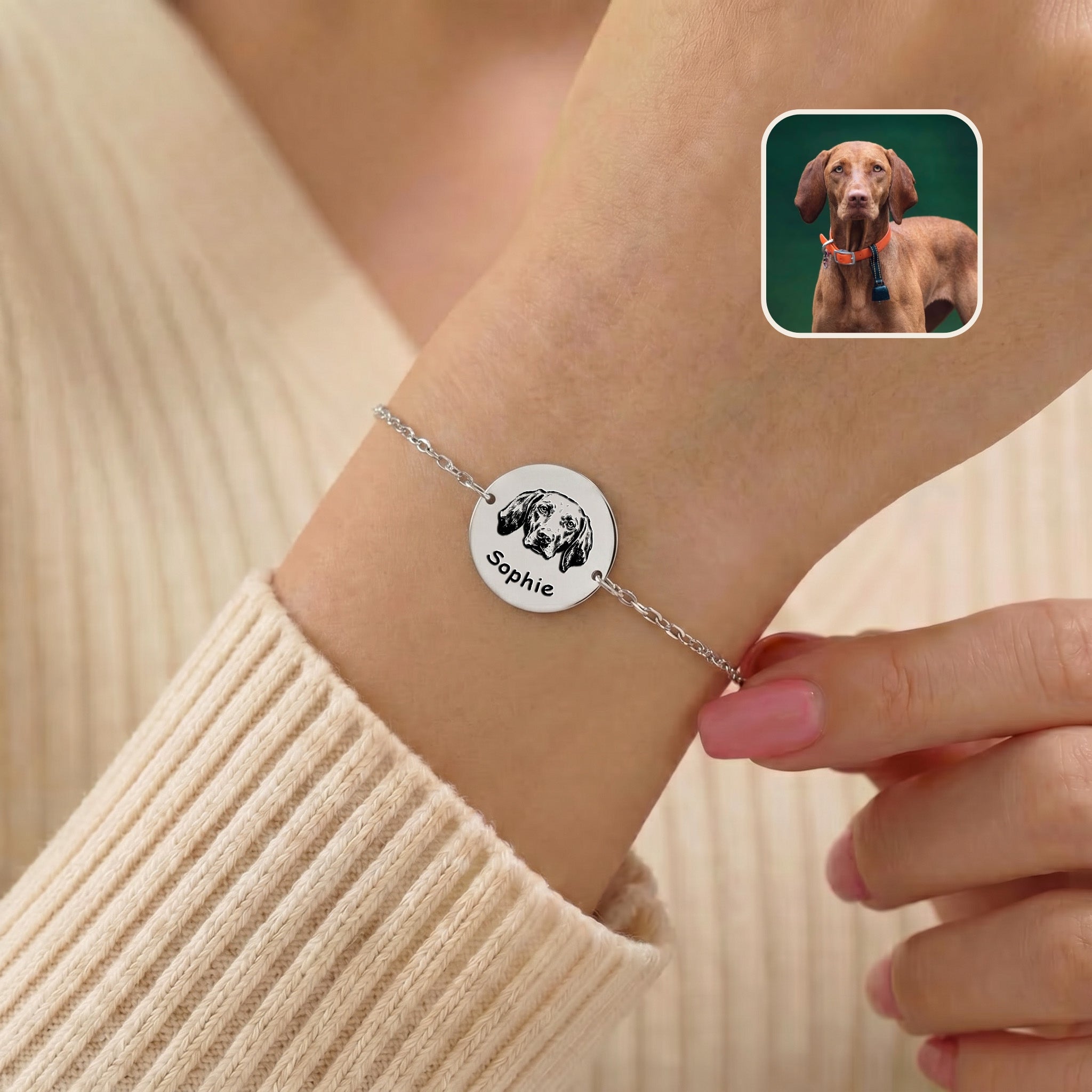 Rhodium-plated pet portrait chain bracelet on a wrist, hand-drawn dog portrait and name on a 25 mm disc charm, with inset reference photo