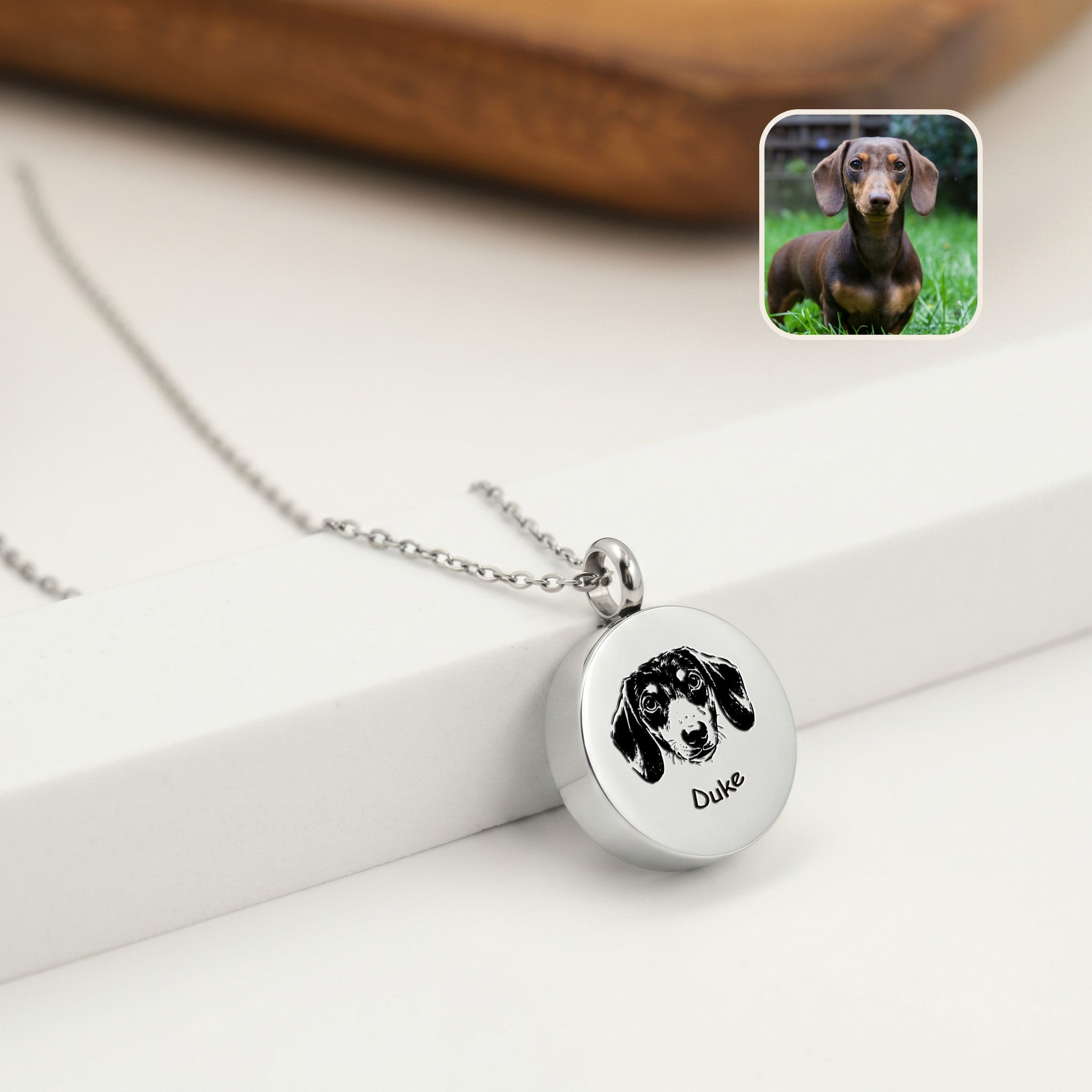 Rhodium pet ashes necklace with hand-drawn dachshund portrait on disc urn pendant
