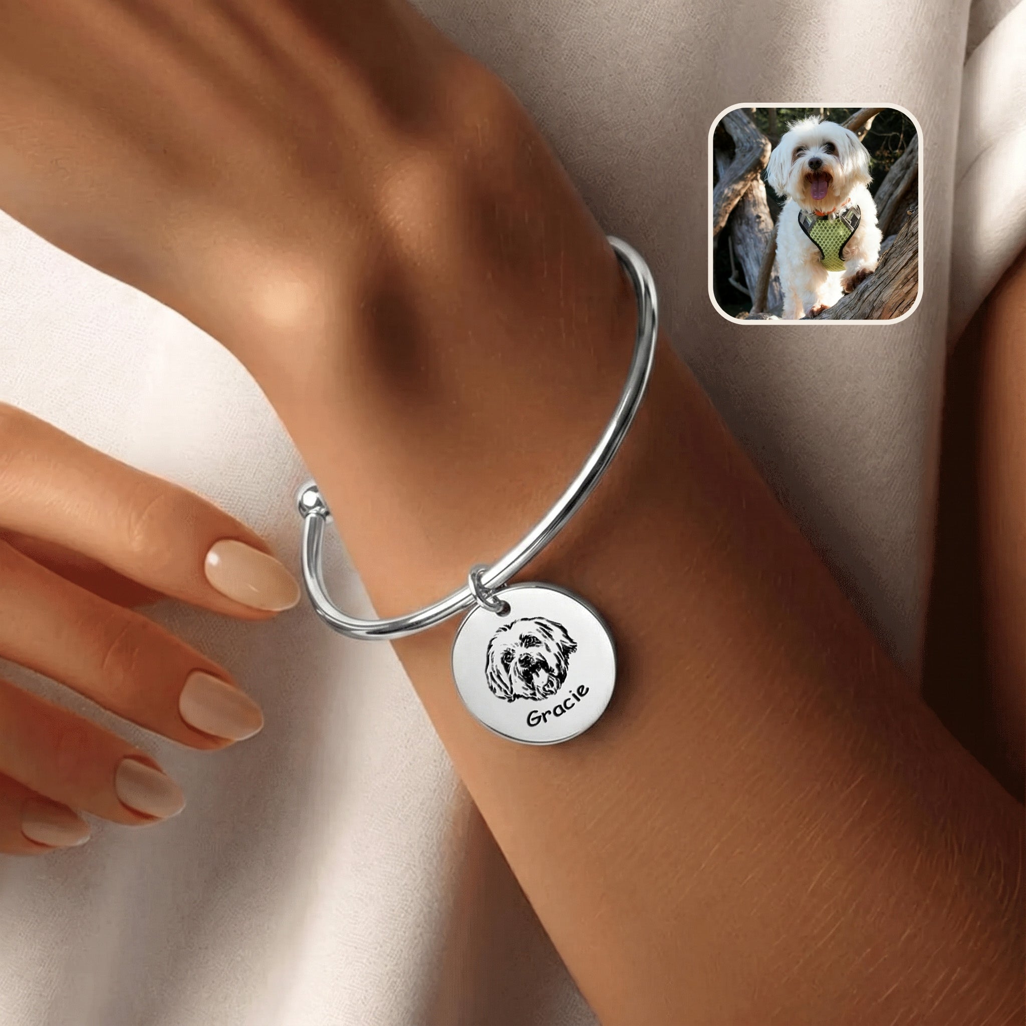 Rhodium silver pet photo cuff bracelet with hand-drawn portrait disc charm, worn on a wrist beside an inset dog photo
