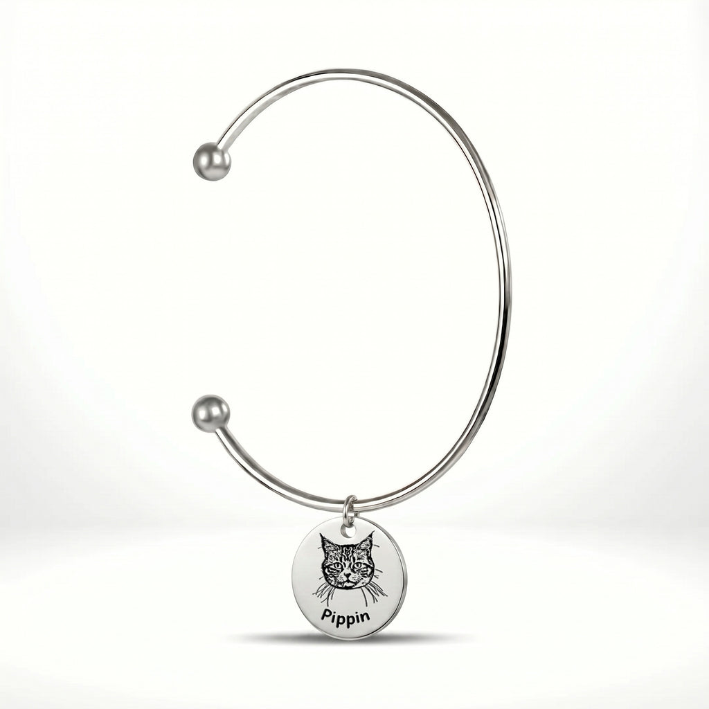 Rhodium silver open cuff bracelet with engraved pet portrait disc charm on a white background