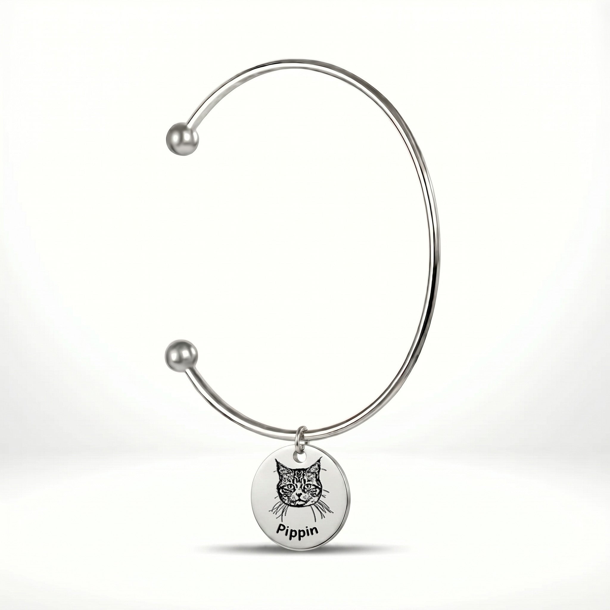 Rhodium silver open cuff bracelet with engraved pet portrait disc charm on a white background