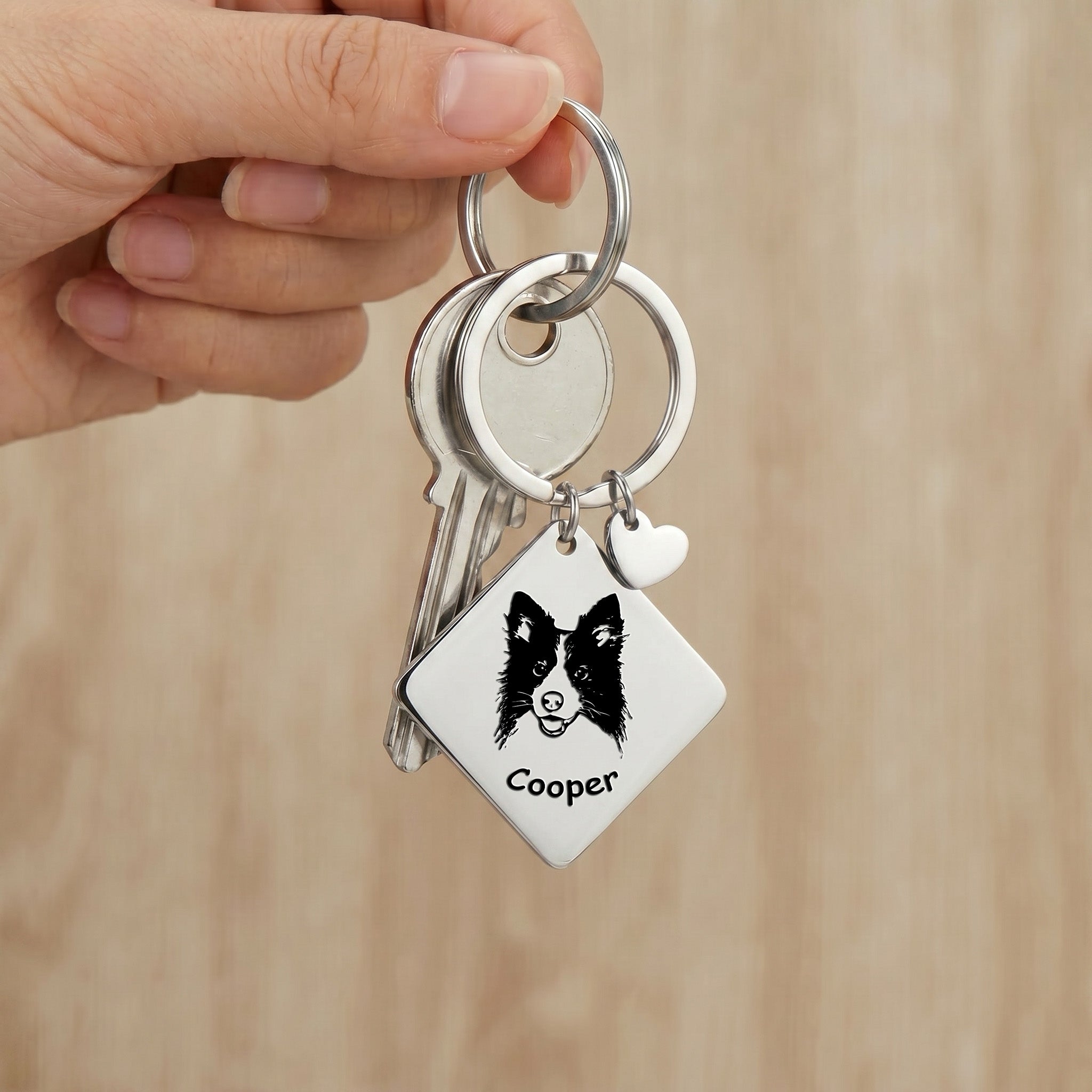 Rhodium pet portrait square keychain clipped to keys with hand-drawn portrait visible