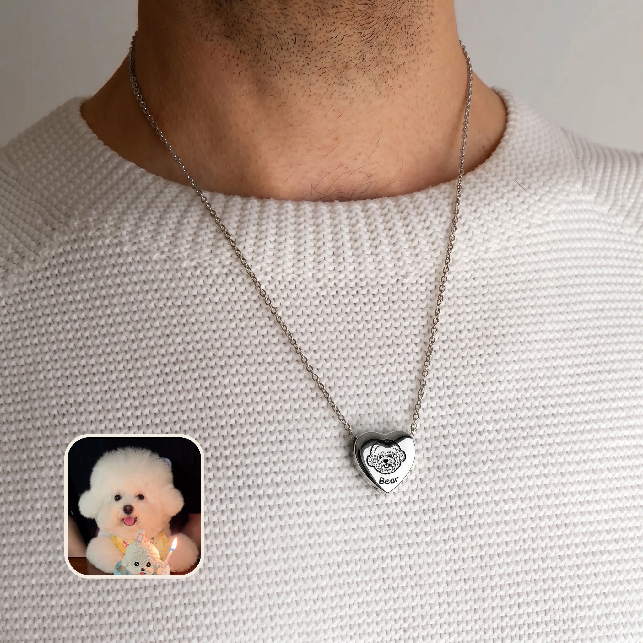 Man wearing rhodium pet photo heart urn necklace over cream sweater with pet photo reference inset