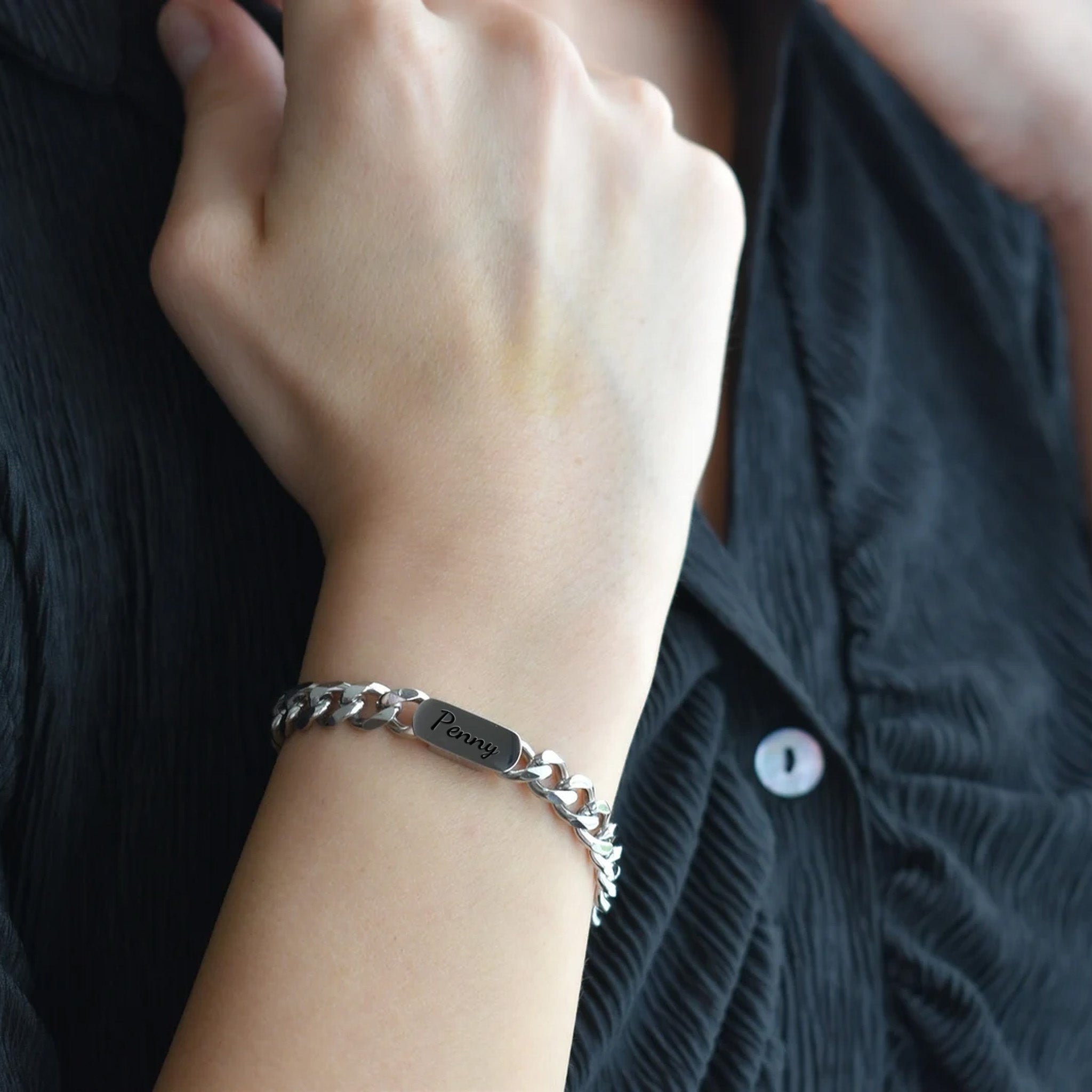 Rhodium silver personalized pet name bracelet engraved in script, worn on the wrist