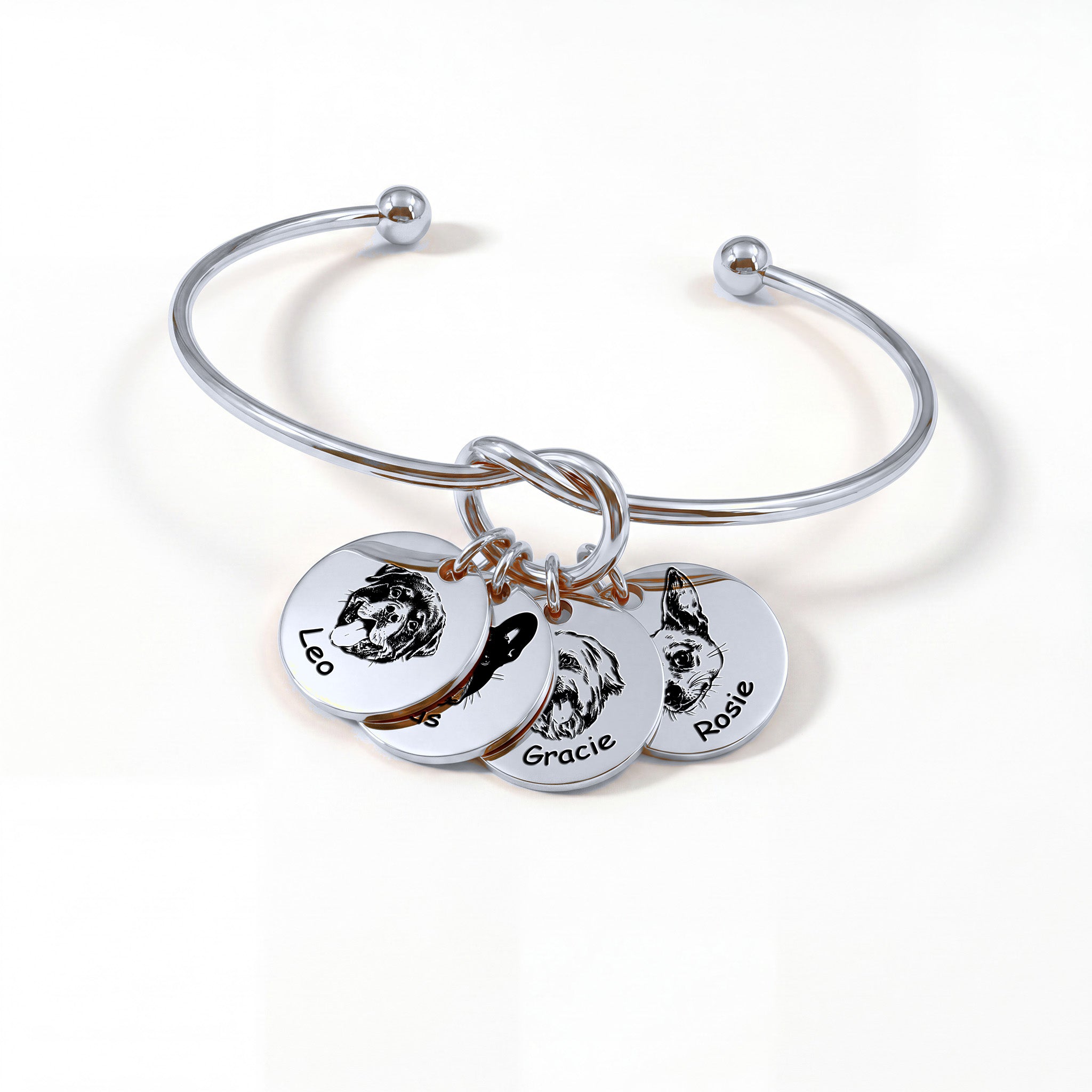 Silver rhodium knot cuff bracelet with four engraved pet portrait disc charms on a white background