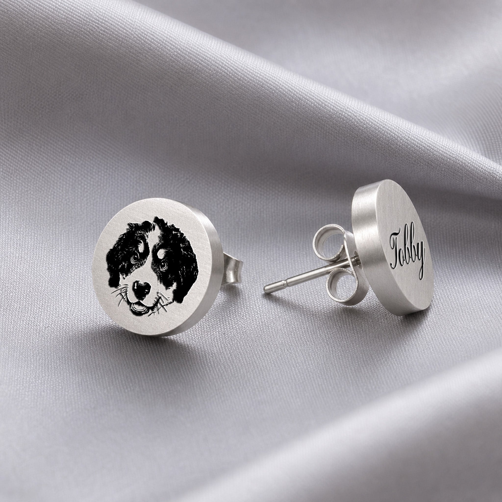 Silver pet portrait stud earrings as a pair, hand-drawn portrait on one disc stud and name in script on the other