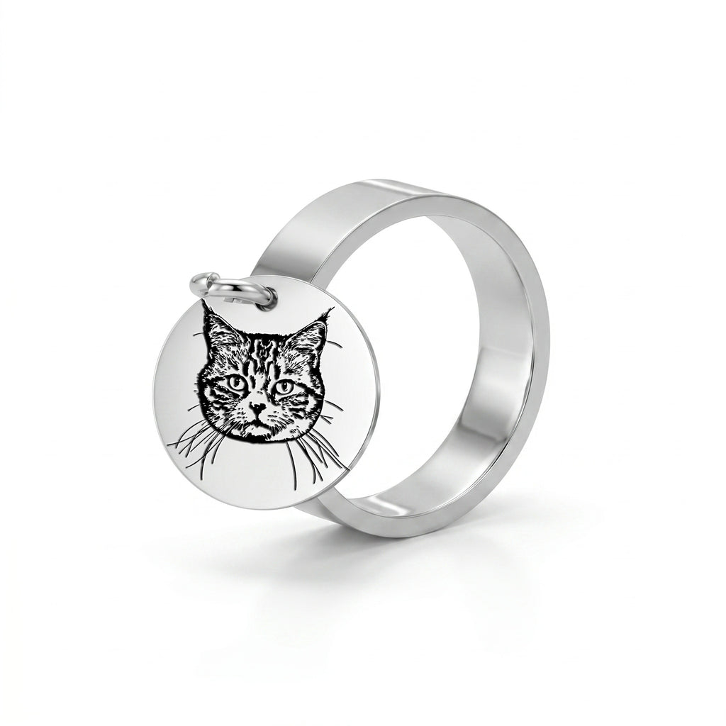 Silver-tone wide-band ring with a dangling pet-portrait disc charm, on a white studio background