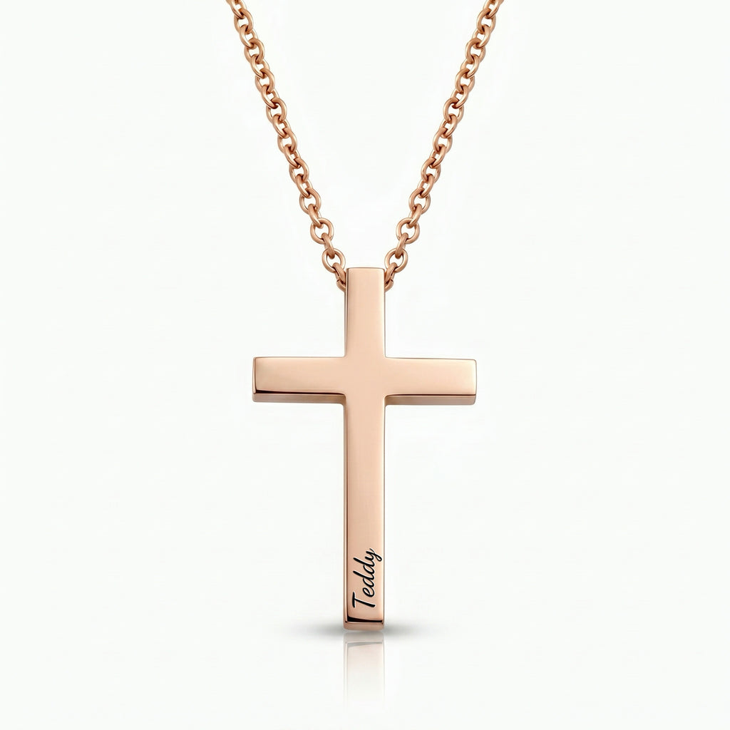 18K rose gold cross necklace with pet name engraved in script on white background