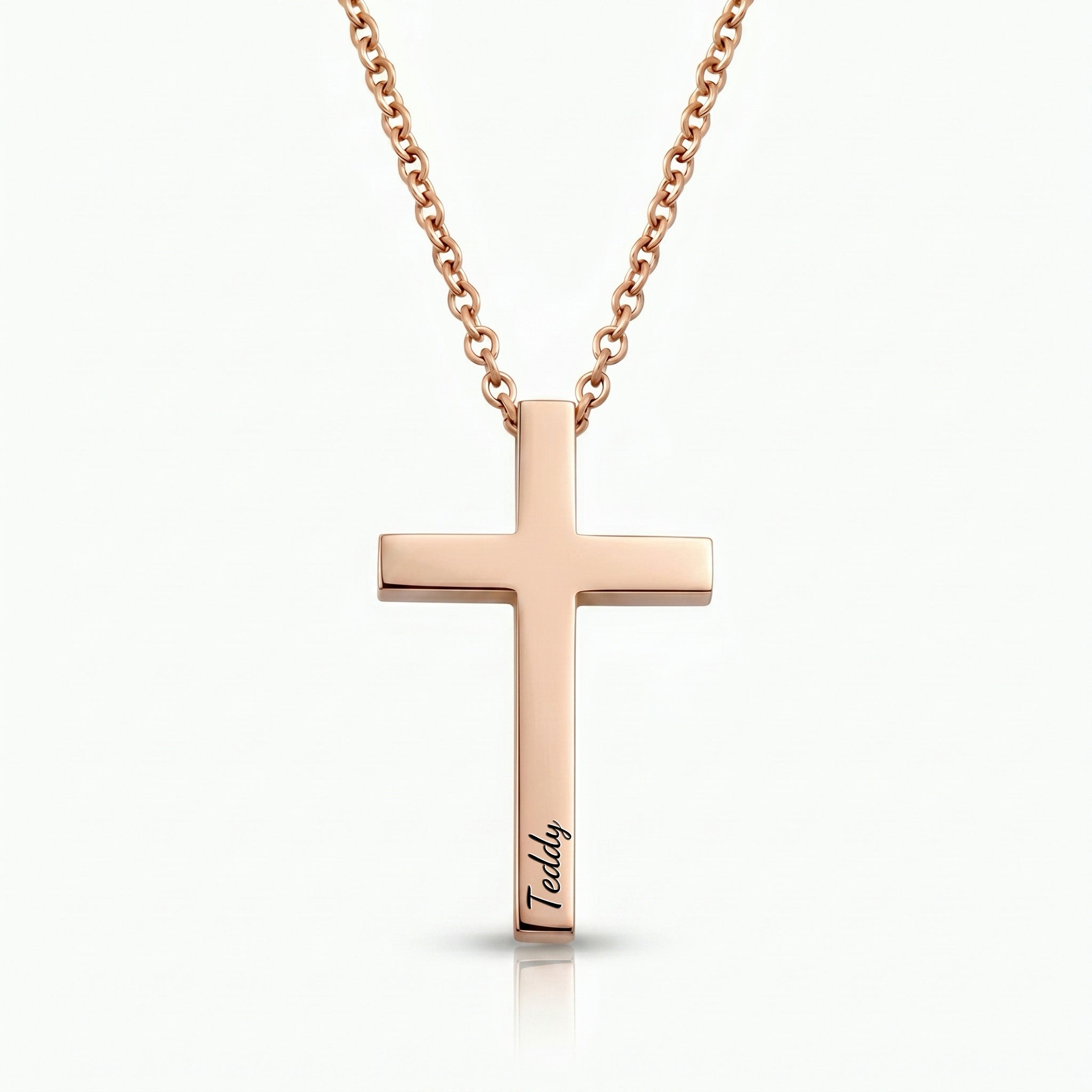 18K rose gold cross necklace with pet name engraved in script on white background