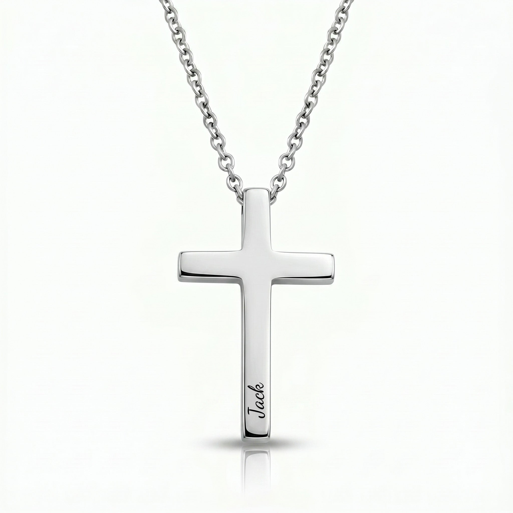 Rhodium silver cross necklace with pet name engraved in script on white background