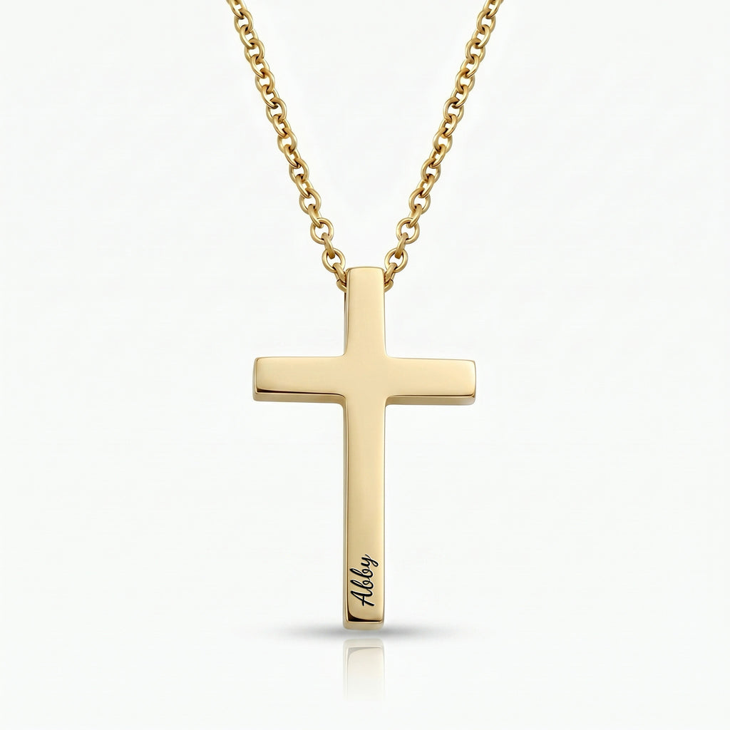 18K gold cross necklace with pet name engraved in script on white background