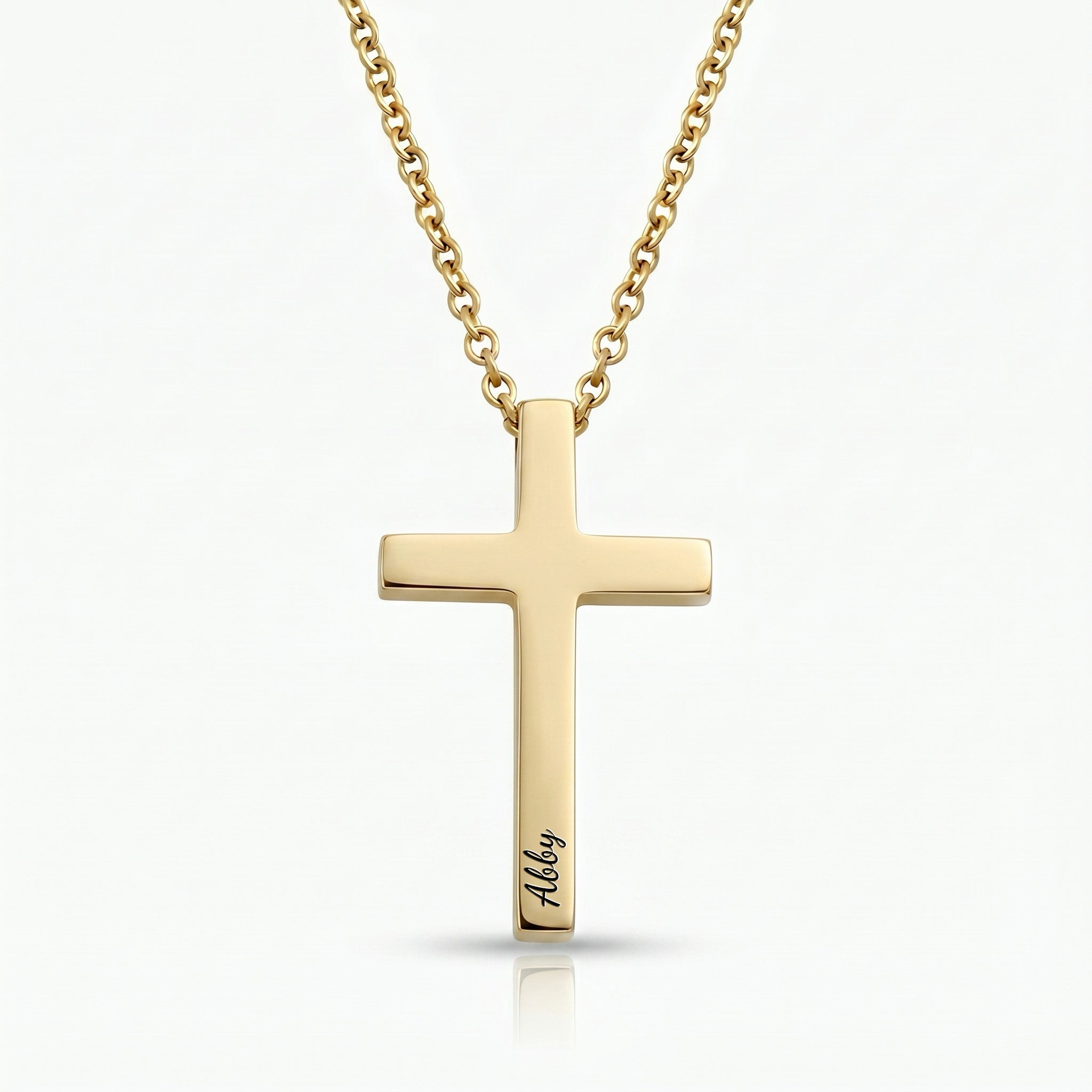 18K gold cross necklace with pet name engraved in script on white background