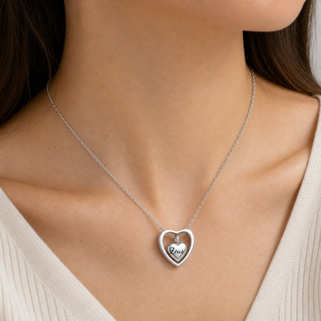 Woman wearing rhodium heart urn memorial necklace at neckline, lifestyle shot