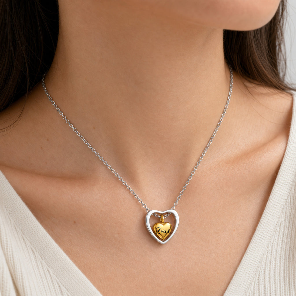 Woman wearing 18k gold heart urn memorial necklace at neckline, lifestyle shot
