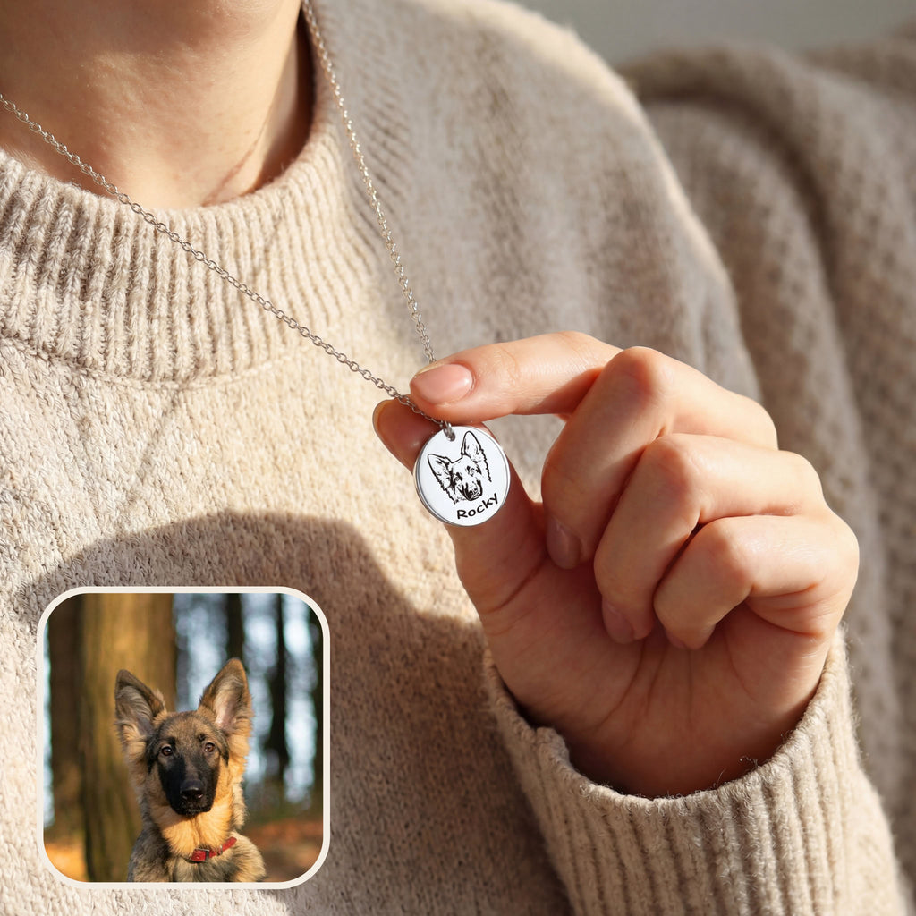 Woman wearing silver pet face necklace with dog portrait pendant over knit sweater