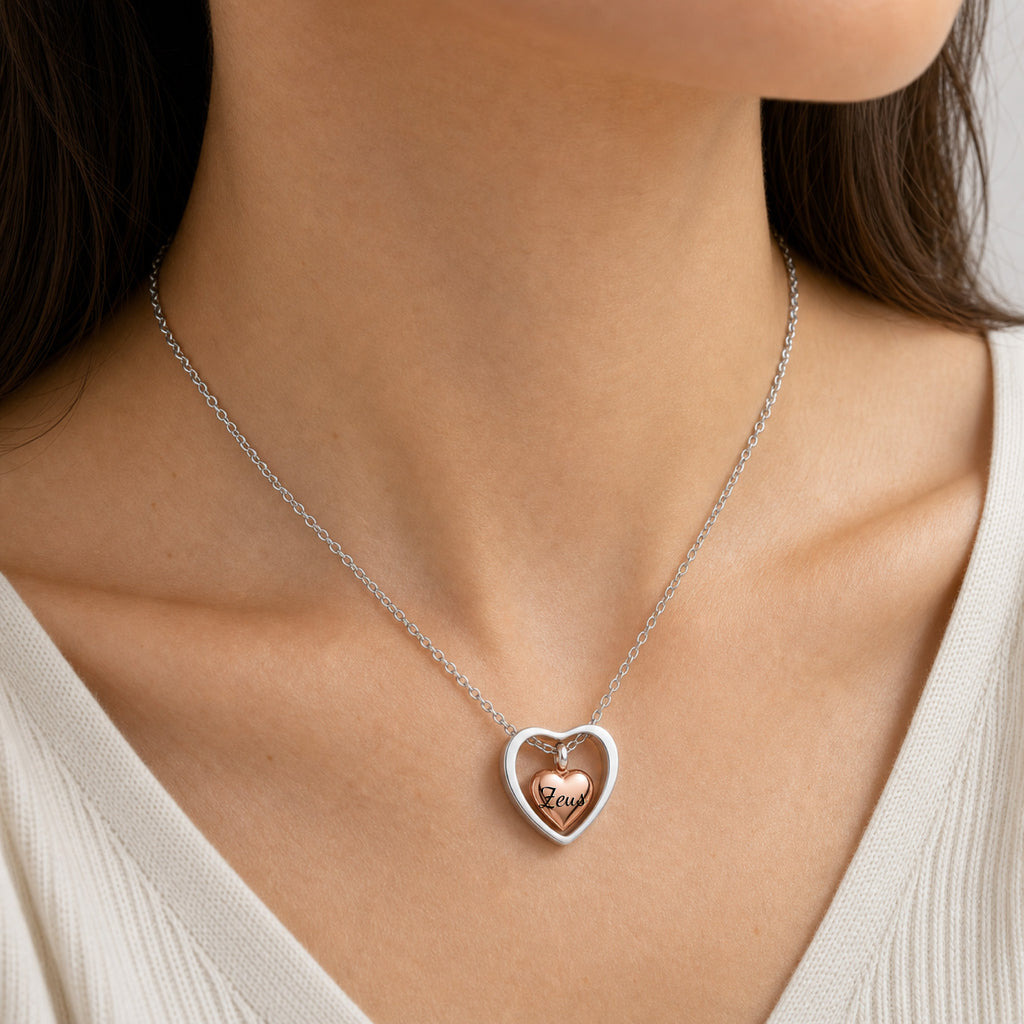 Woman wearing 18k rose gold heart urn memorial necklace at neckline, lifestyle shot