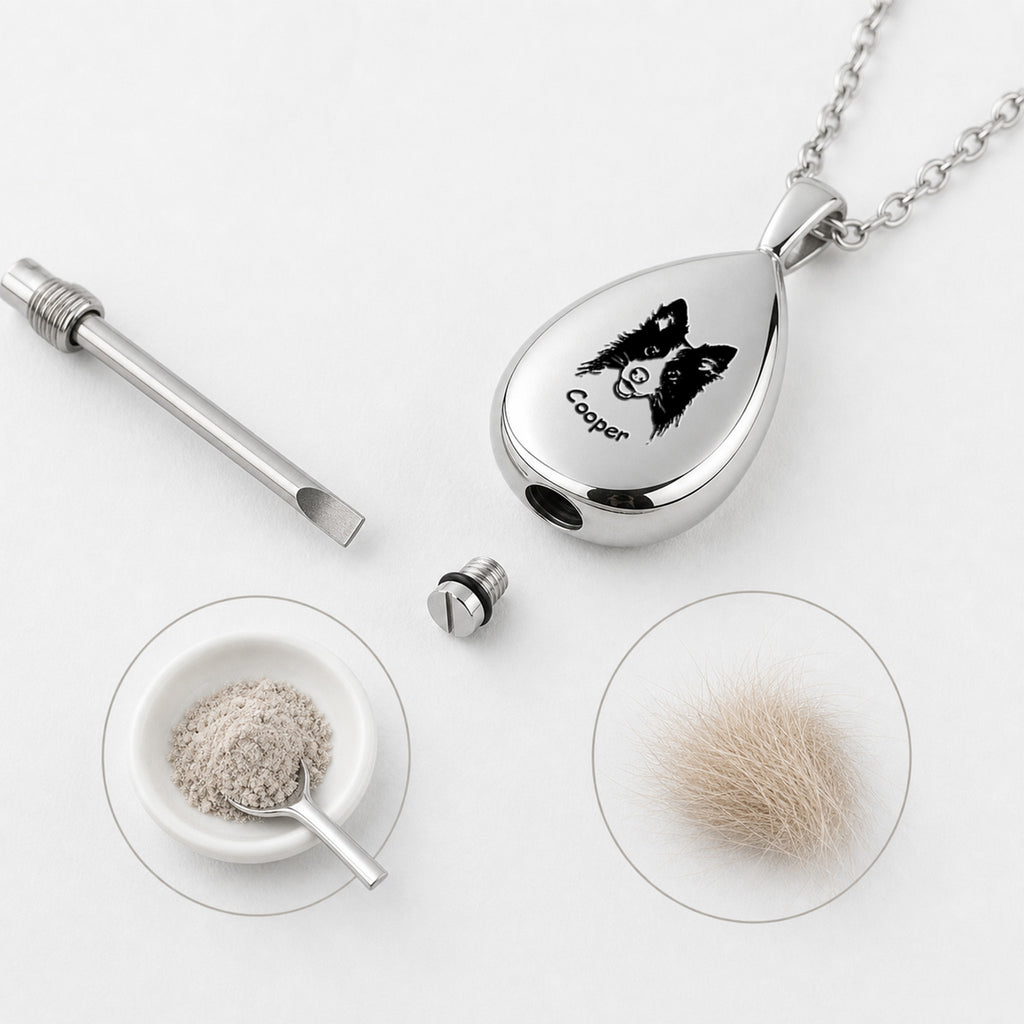 Silver teardrop pet urn pendant close-up on light background, clean product view