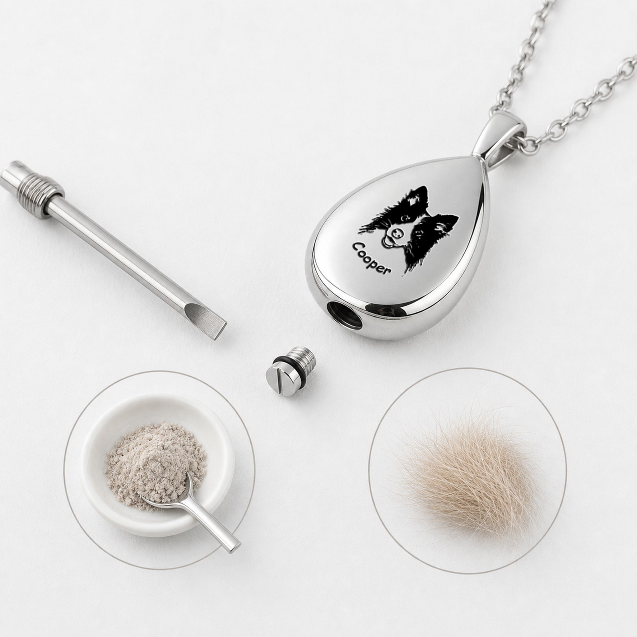 Silver teardrop pet urn pendant close-up on light background, clean product view