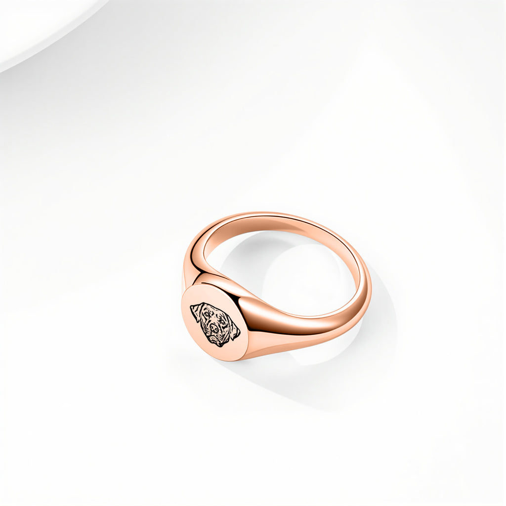 Rose gold pet face ring with hand-drawn portrait engraving on a signet-style band