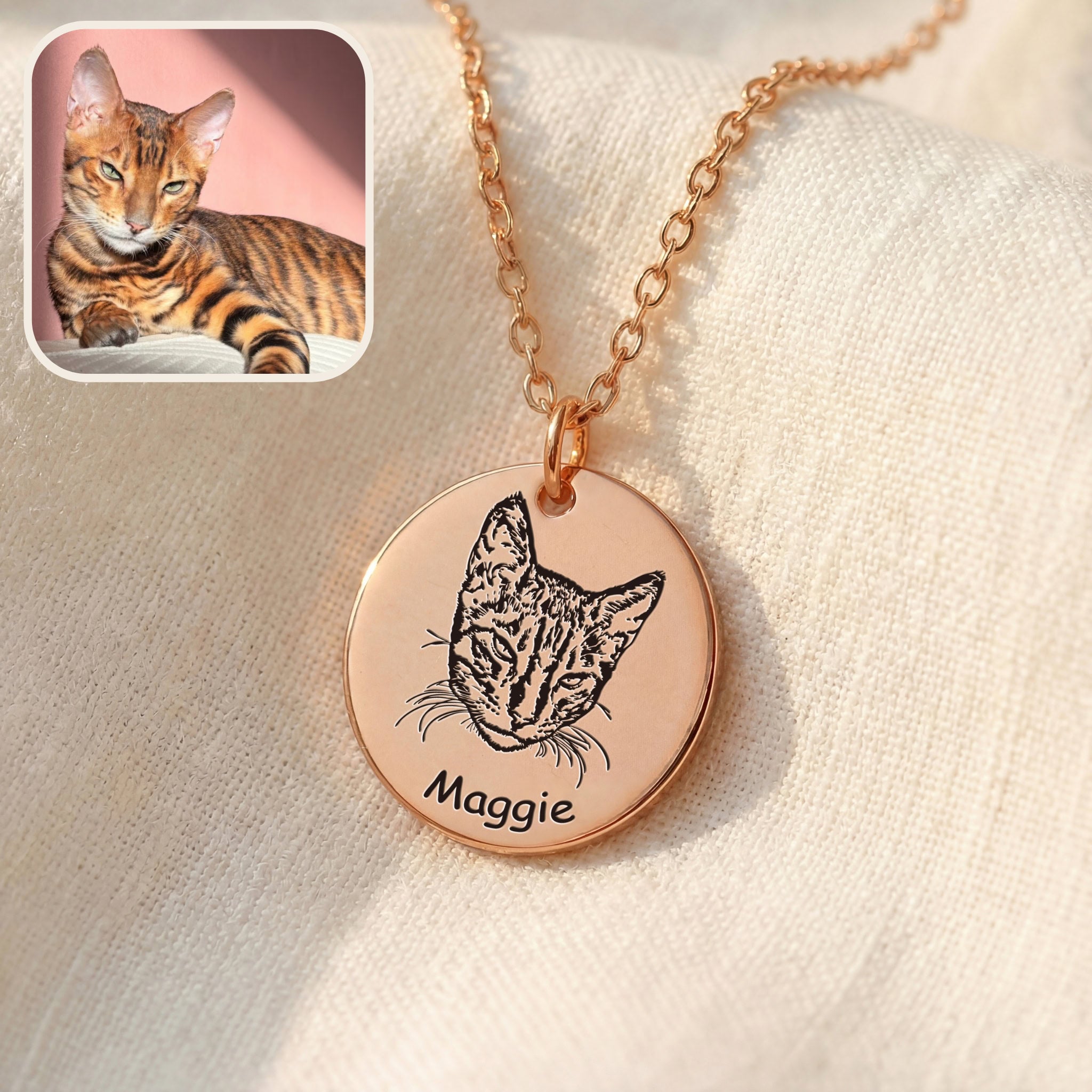 Rose gold disc pendant necklace with hand-drawn cat portrait engraving on soft fabric