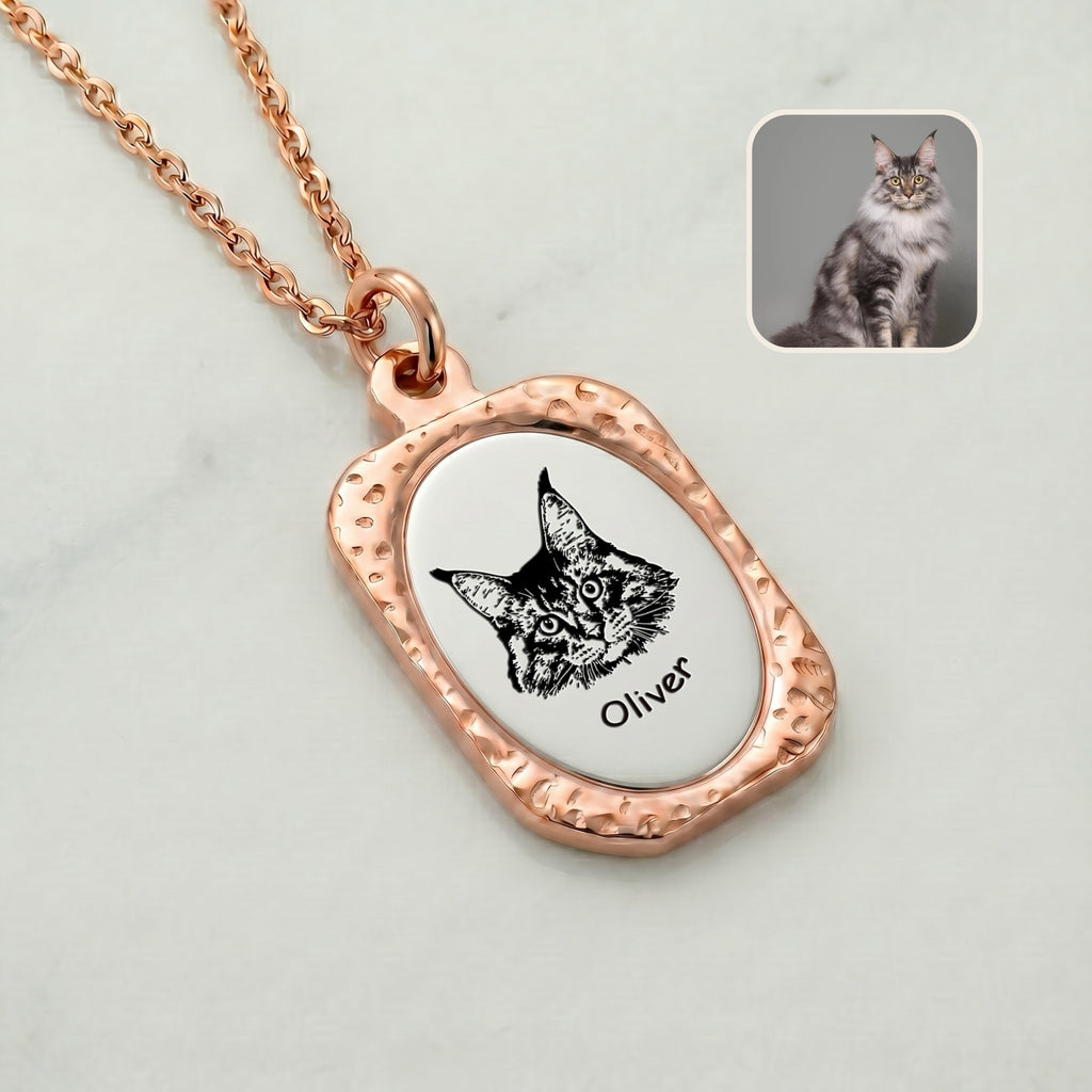 Close-up of 18K rose gold pet memorial pendant with hand-drawn portrait on brushed silver face