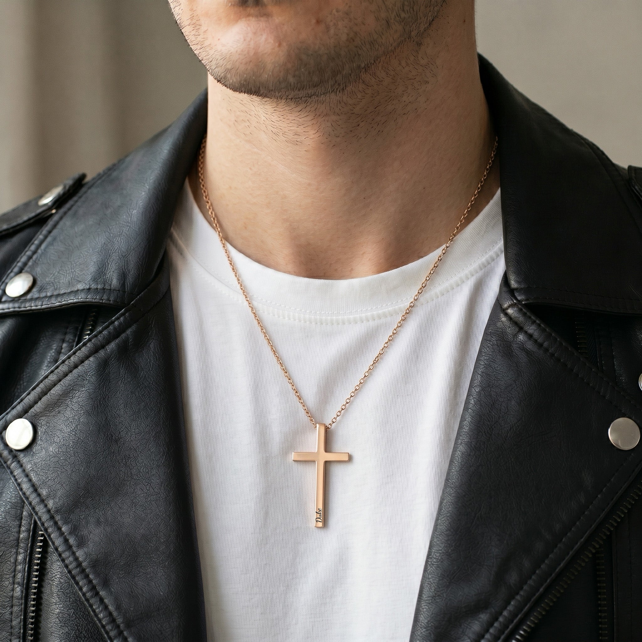 Man wearing 18K rose gold cross necklace with engraved pet name