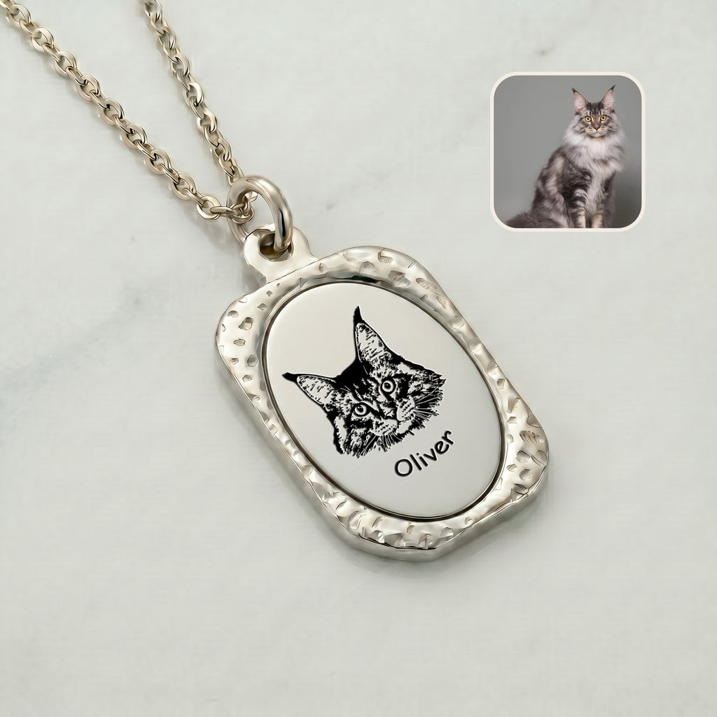 Close-up of rhodium vintage tag pendant with hand-drawn pet portrait showing hammered frame detail